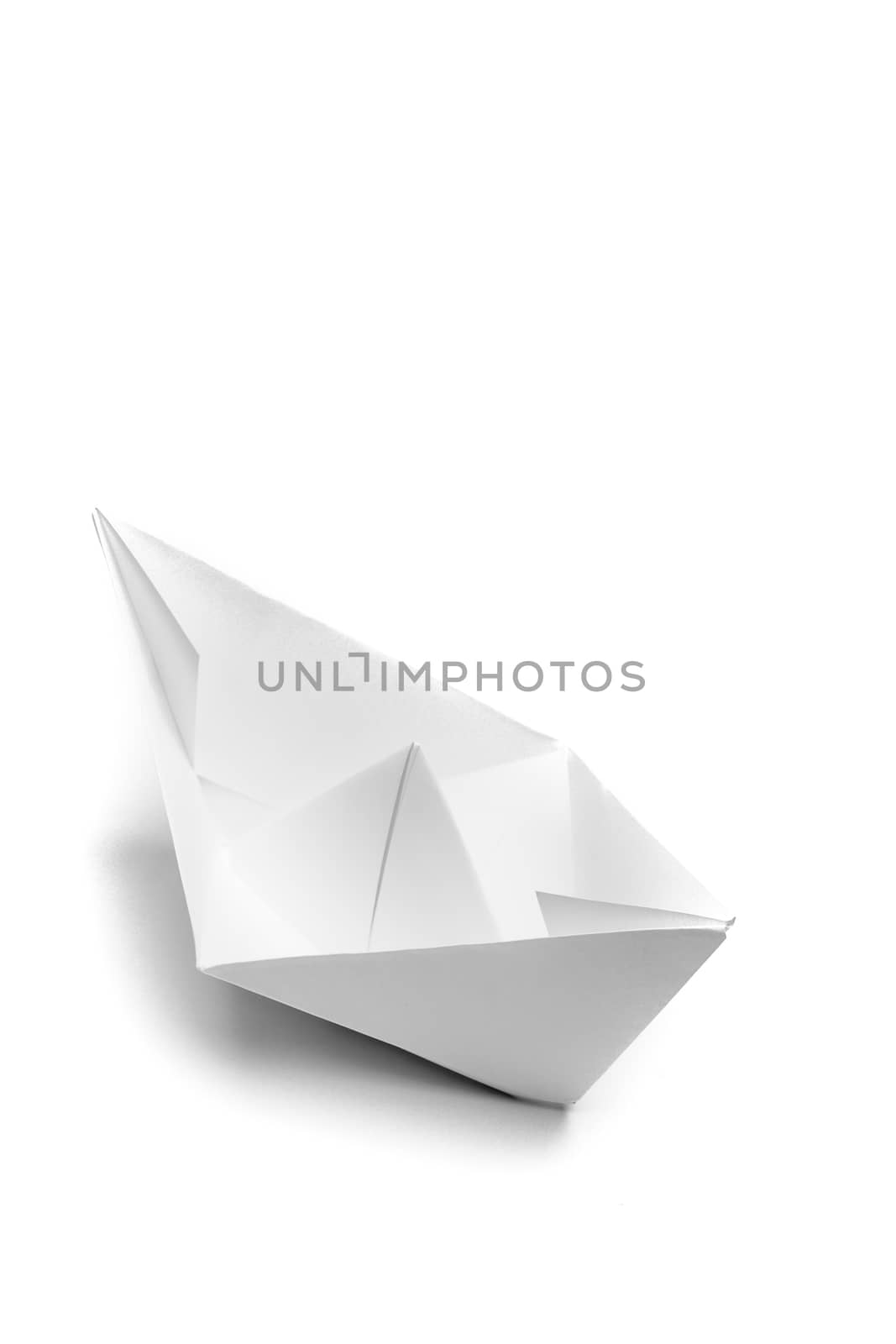 white origami handmade paper ship on white