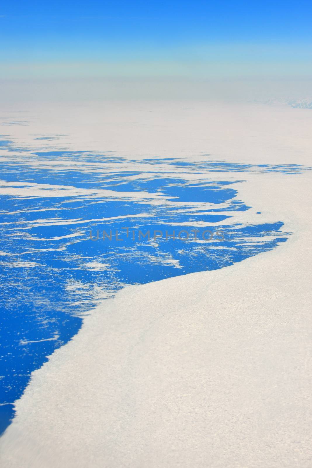 An aerial view of the frozen landscape of Greenland