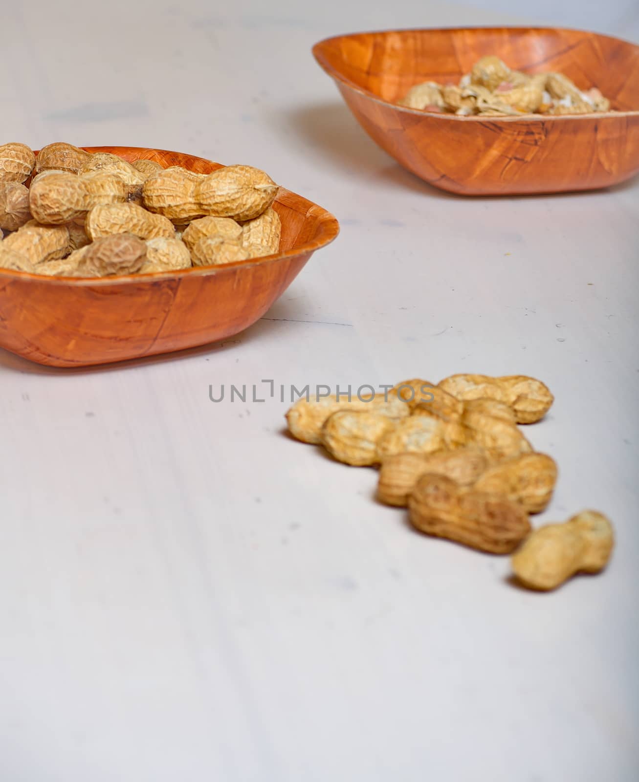 Peanuts in a brown bowl