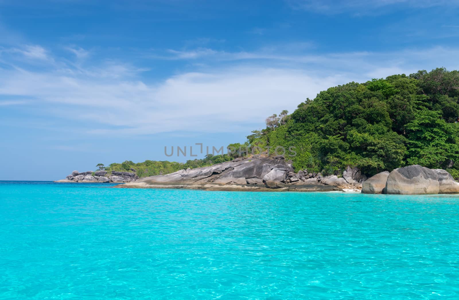 Idyllic tropical blue sea and stone shore of Similan Islands with transparent  turquoise water, Ko Miang, National Park 