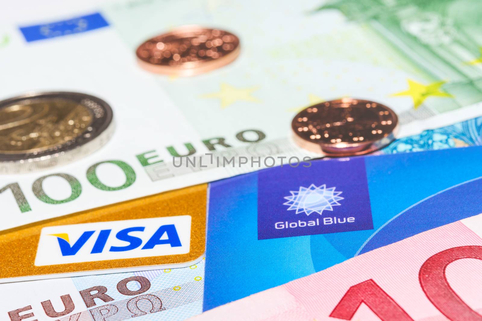 MUNICH, GERMANY - FEBRUARY 23, 2014: Visa credit card and Global Blue tax free against cash money