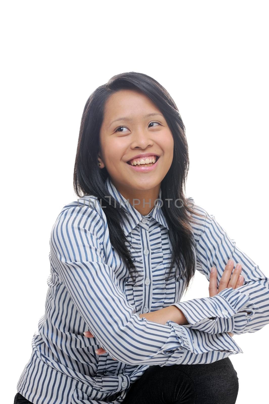happy asian girl looking away with arms crossed