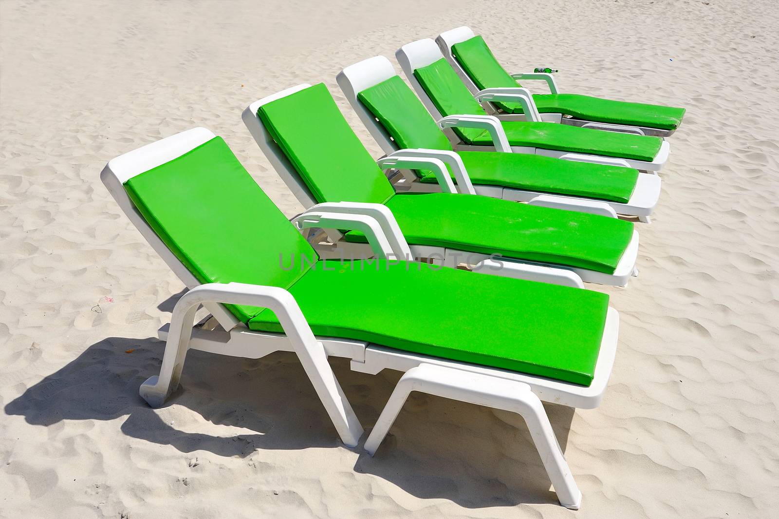 colorful of Deck Chairs on the Beach in Sunny Day ,Pattaya Thail by think4photop