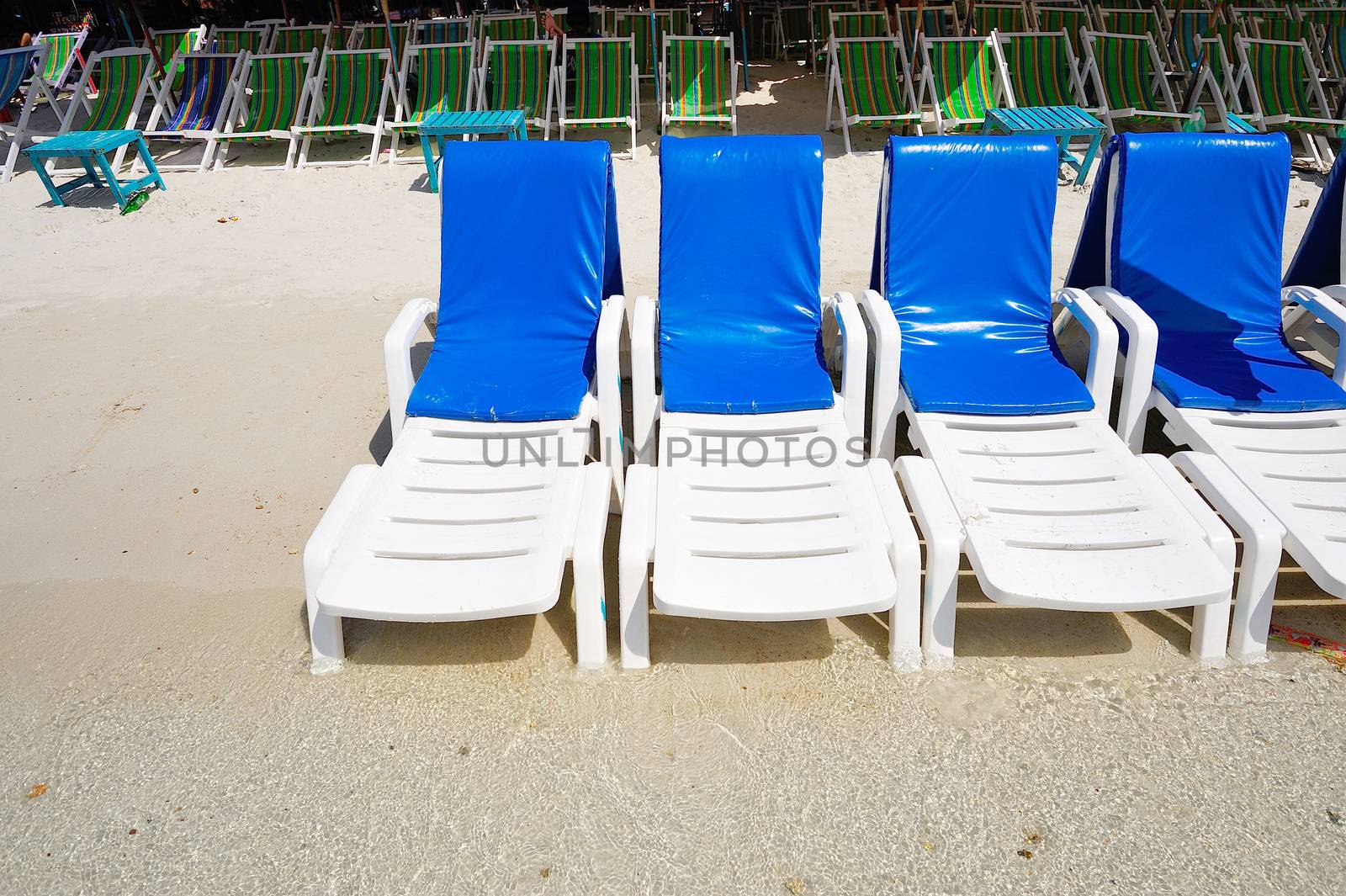 deck chairs on the beach at koh lan ,pattaya, thailand by think4photop