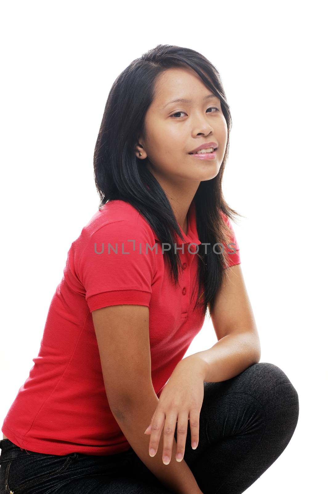 Relaxed asian teen girl wearing red shirt