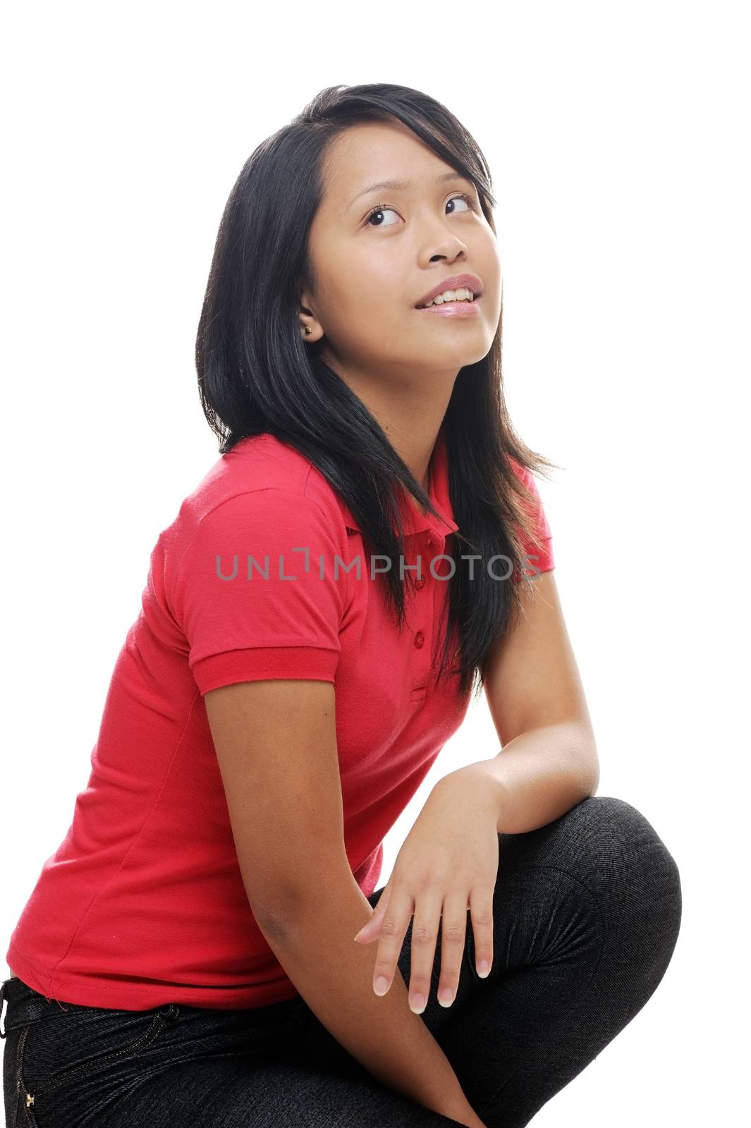 Asian girl wearing red shirt looking up