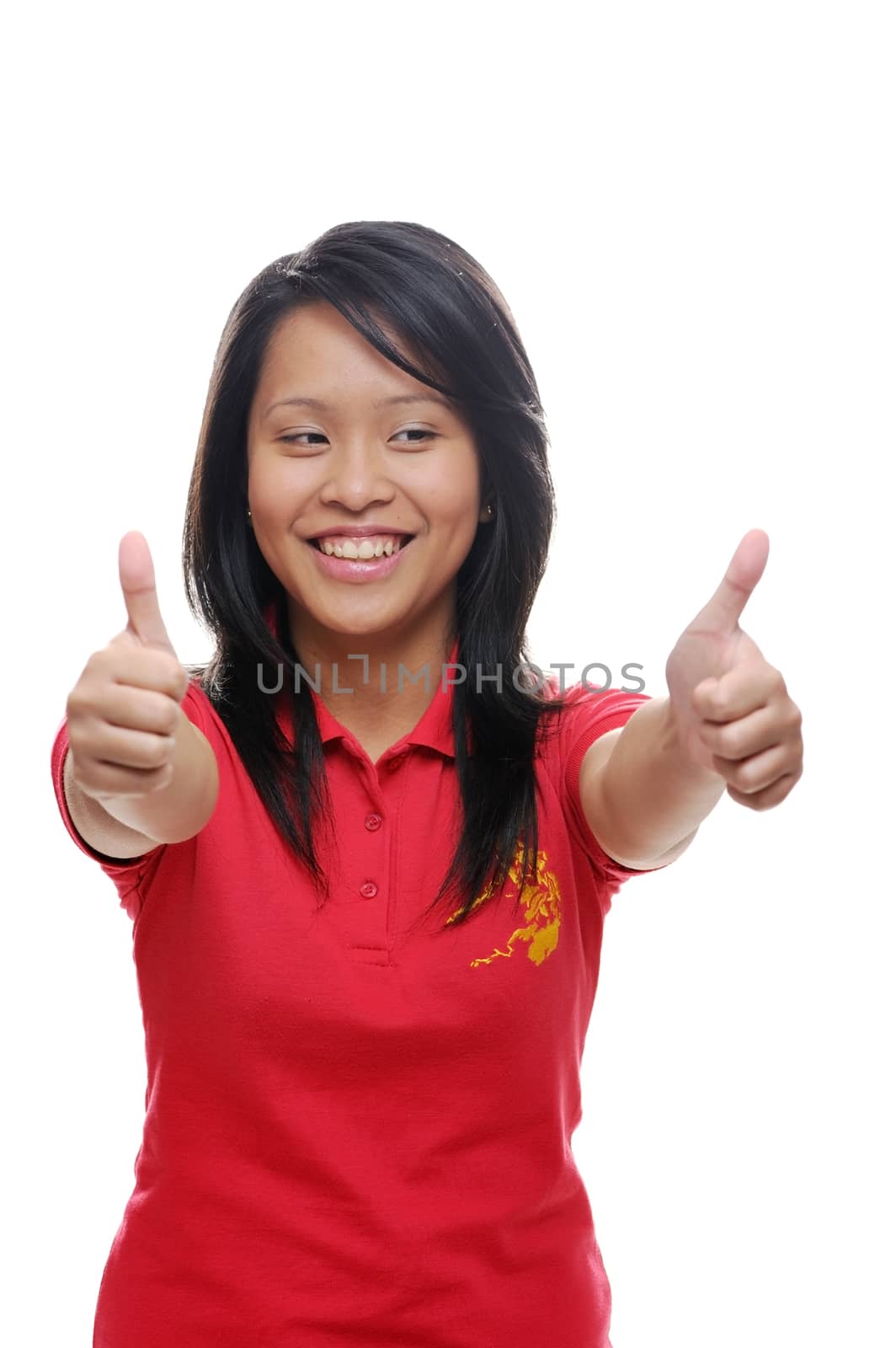 Cheerful asian girl in red with thumbs up