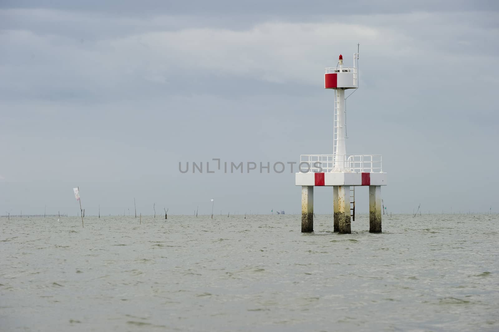 lighthouse in the sea, thailand by think4photop