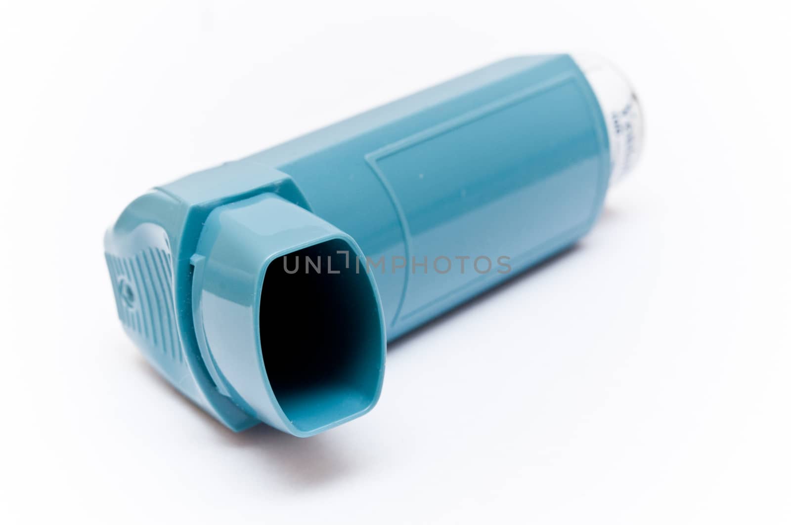 asthma aerosol closeup - white background