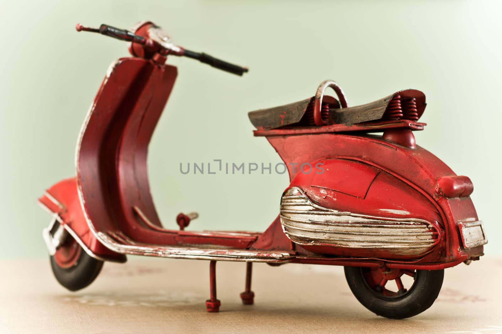 red miniature scooter closeup isolated 