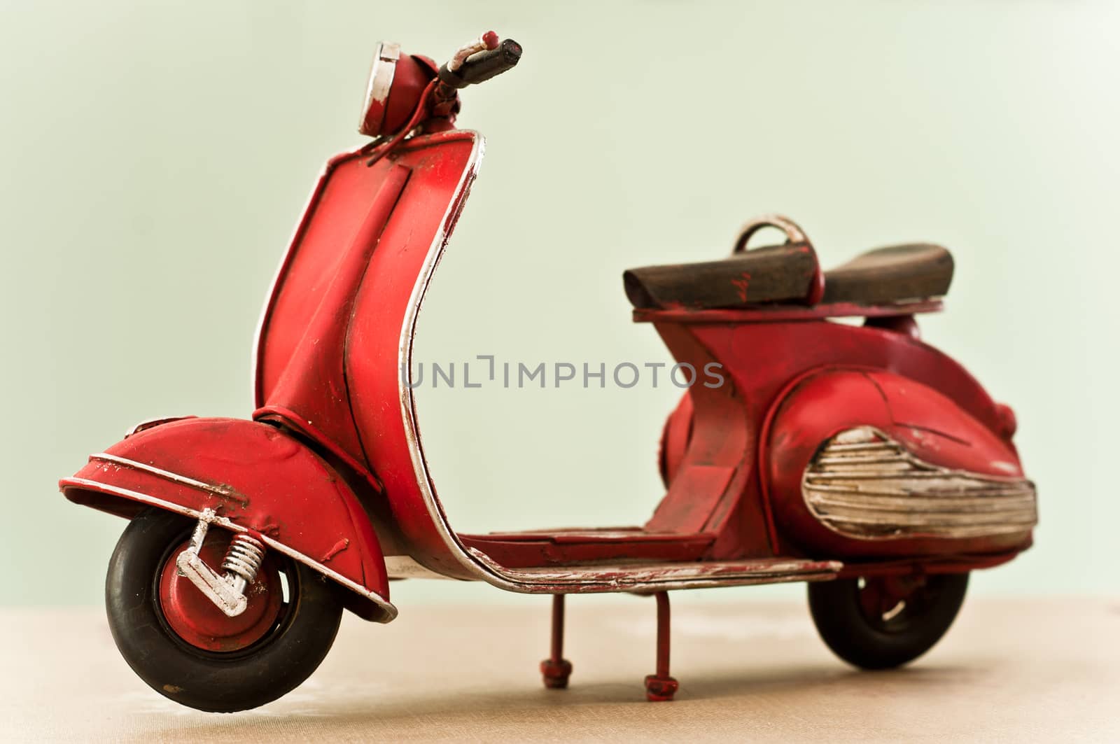 red miniature scooter closeup isolated 