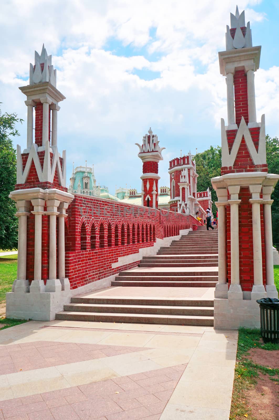 Ancient red brick staircase decorated with white pattern                               