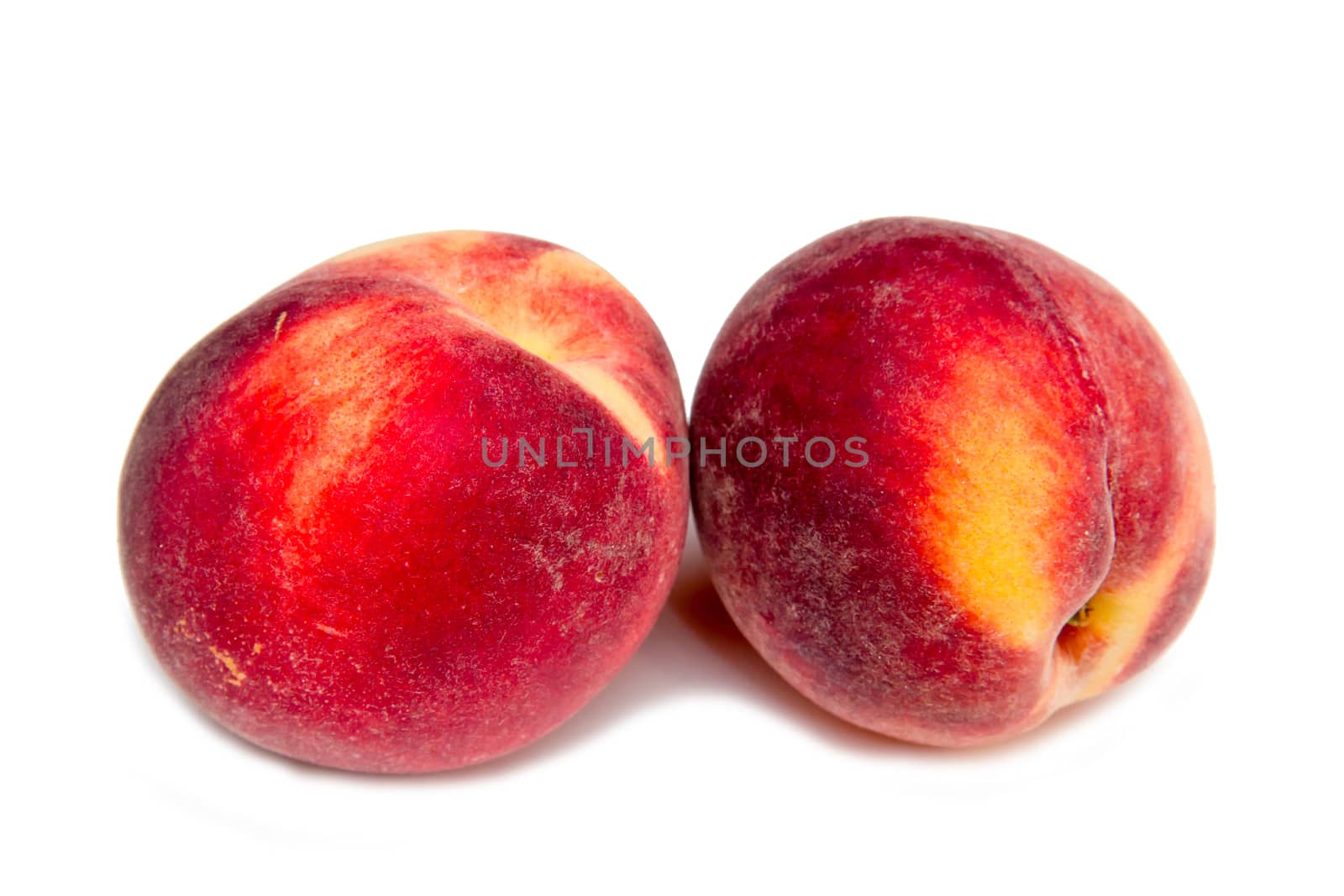 Fresh peaches on white background