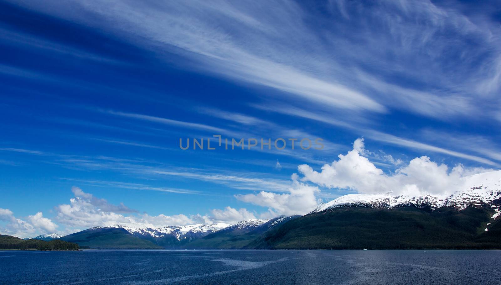 Alaskan Sky and snow topped mountain in Turnagain Arm
