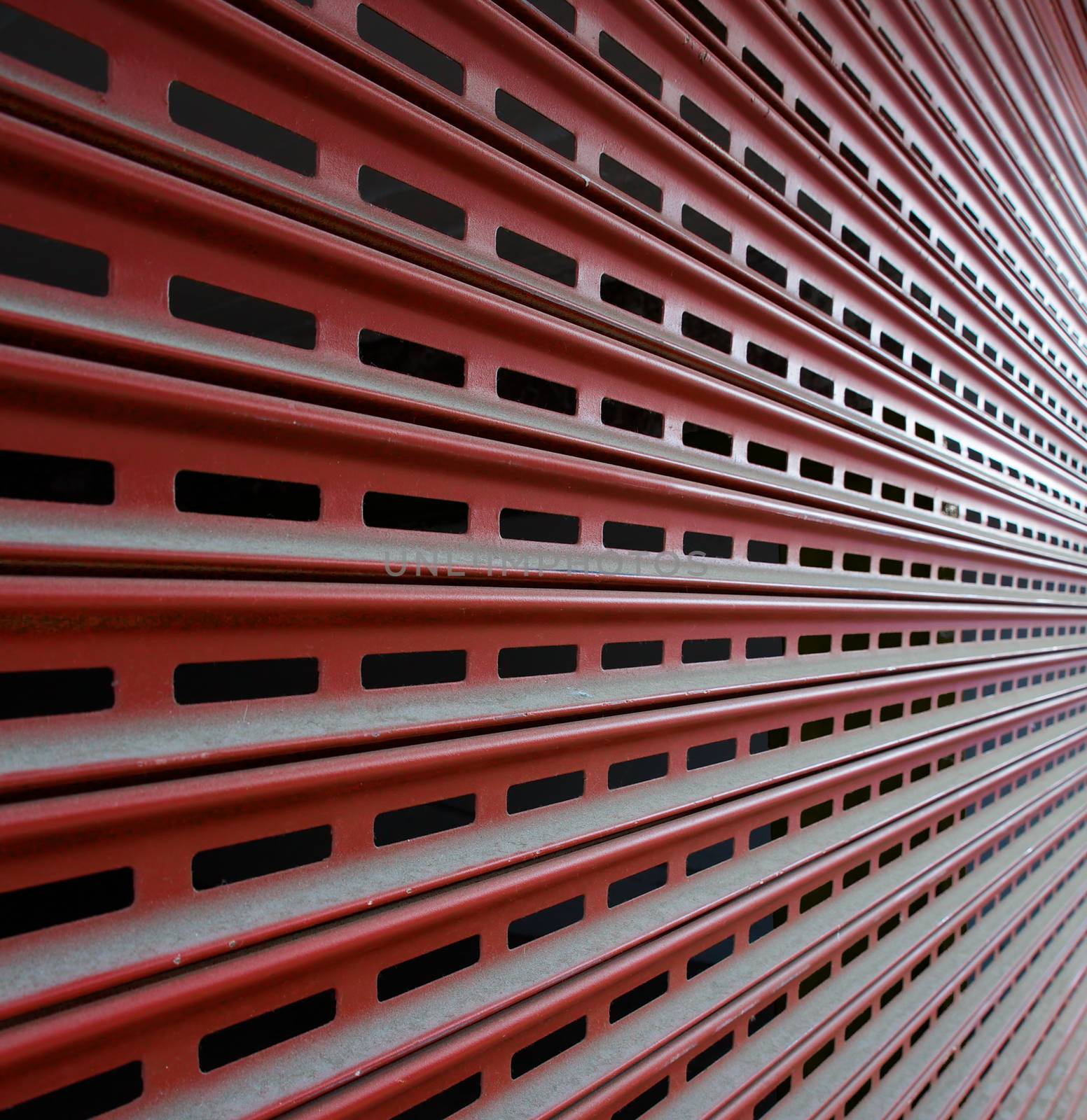 Brown steel Garage Security Gate in a diminishing perspective