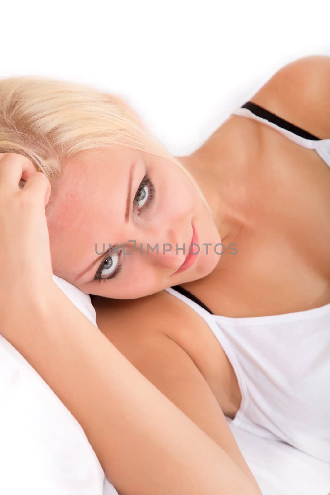 Blonde girl lying sideways in bed by Spectral