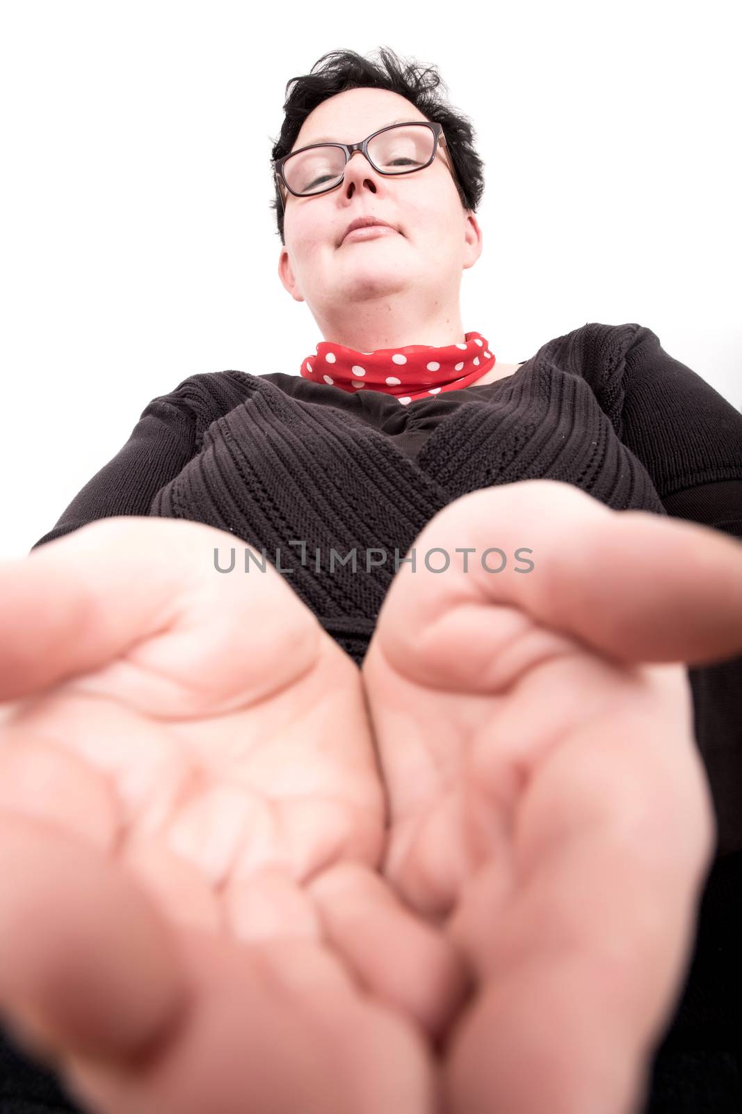 A overweight woman holding her hands open.