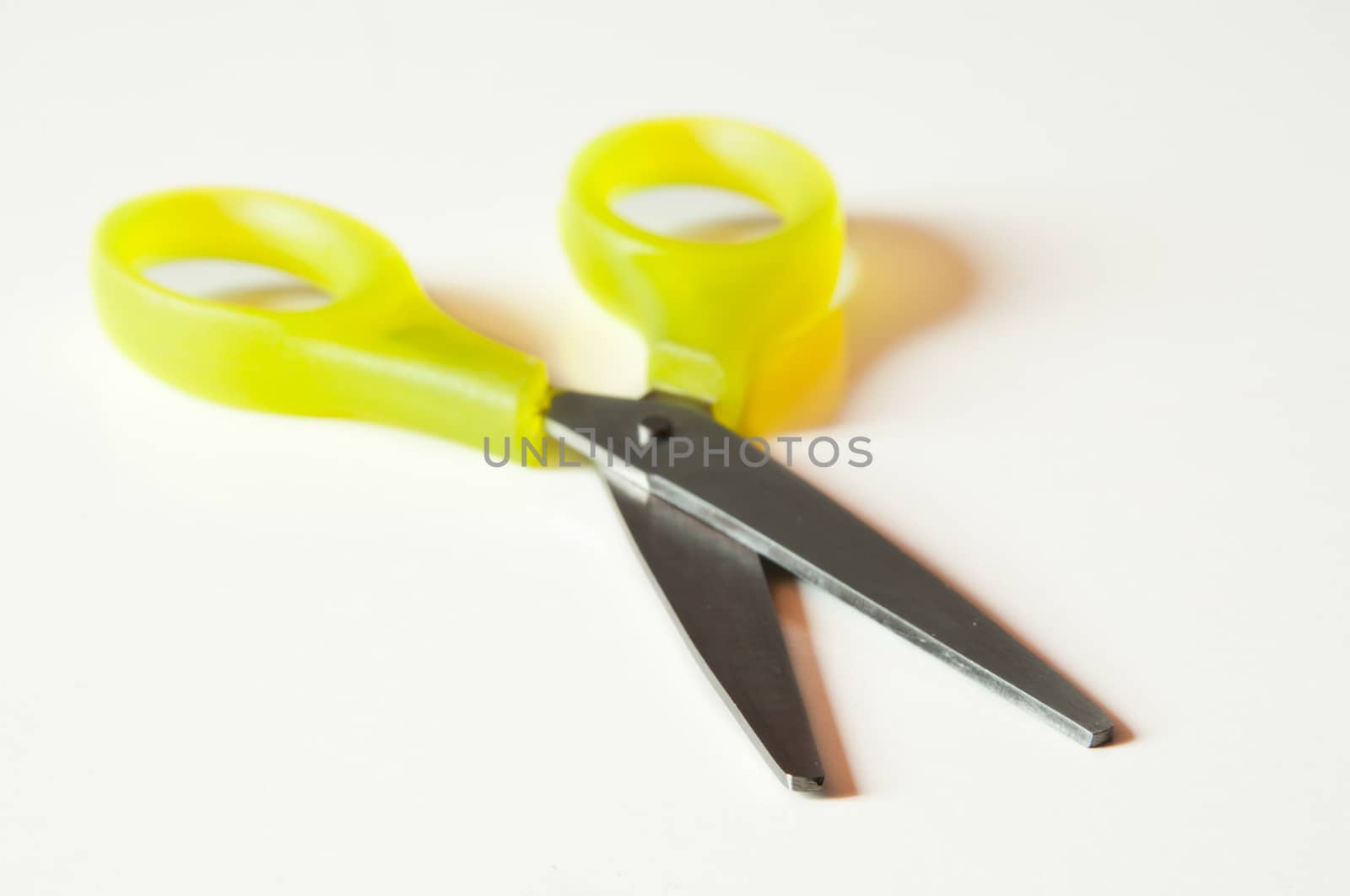 school supplies - yellow scissors closeup
