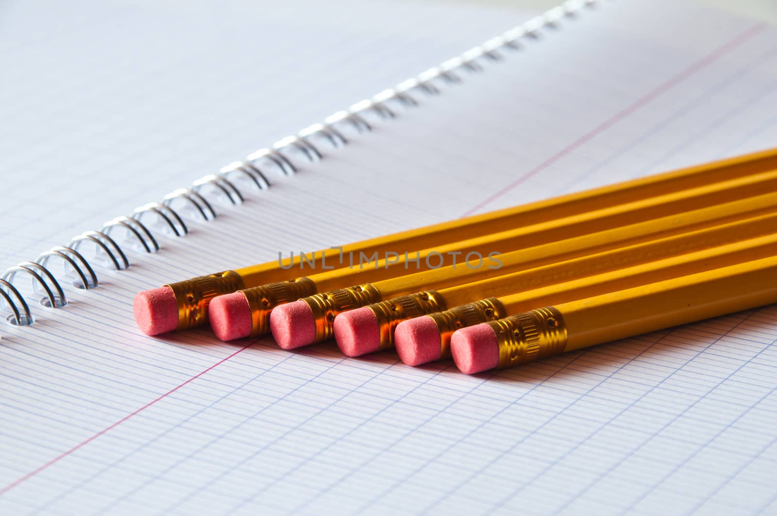 school supplies - pencils on notebook