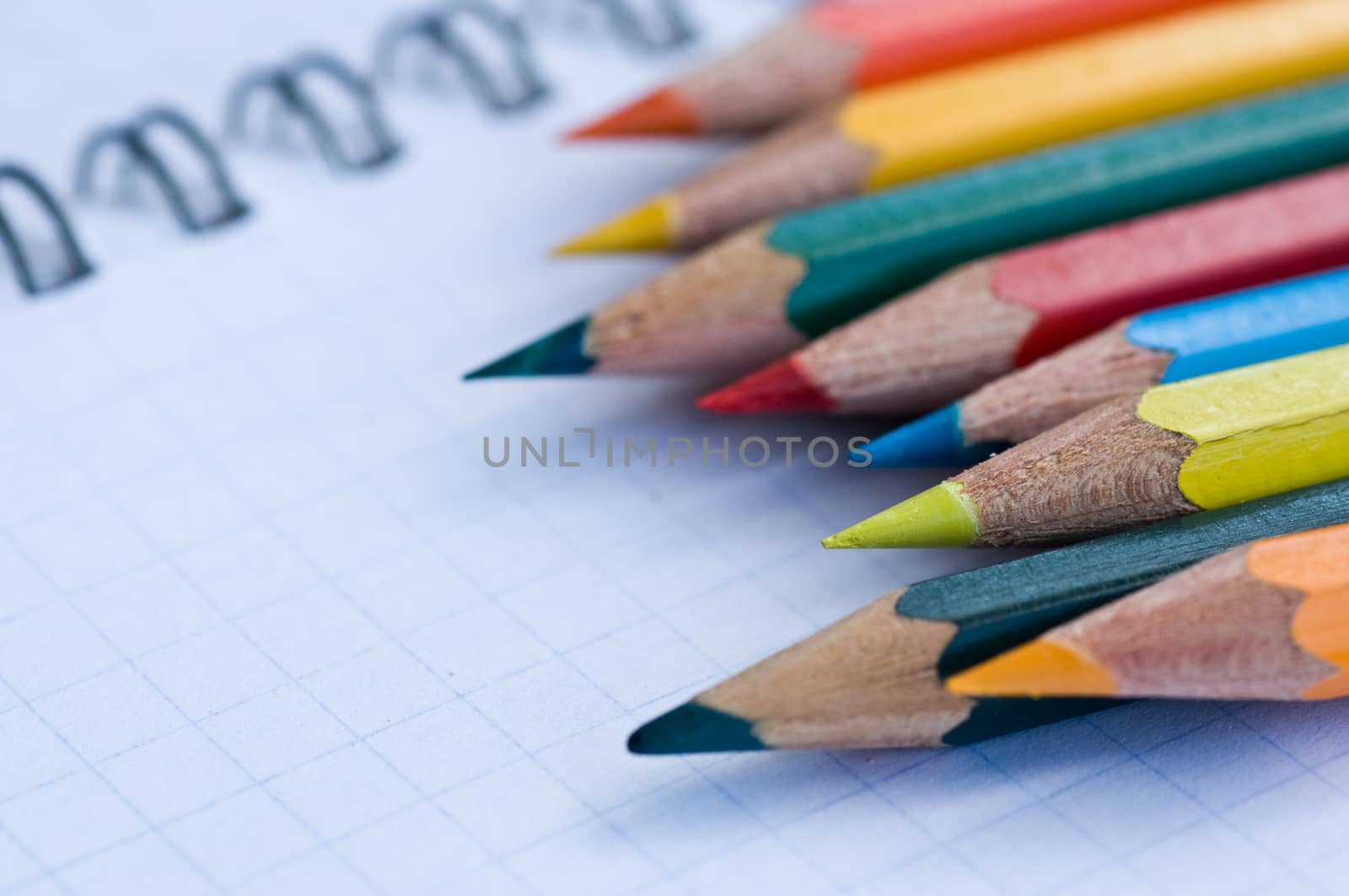 school supplies pencils colors on the beach