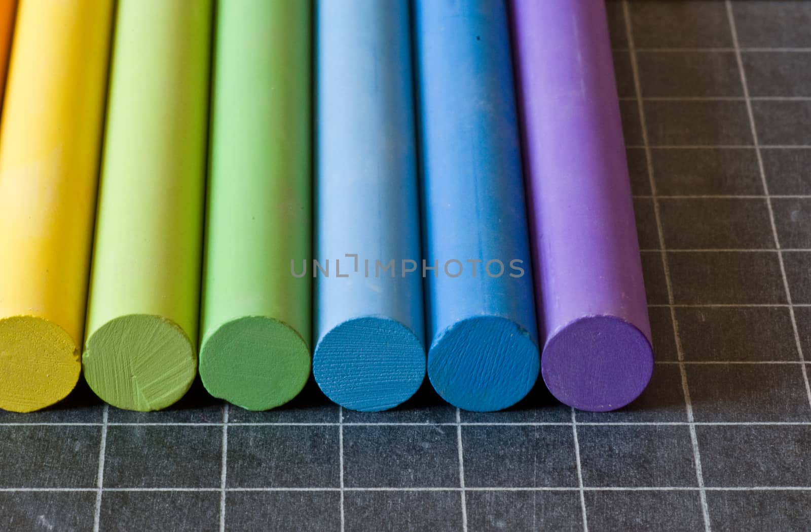 school supplies - chalks on chalkbord closeup