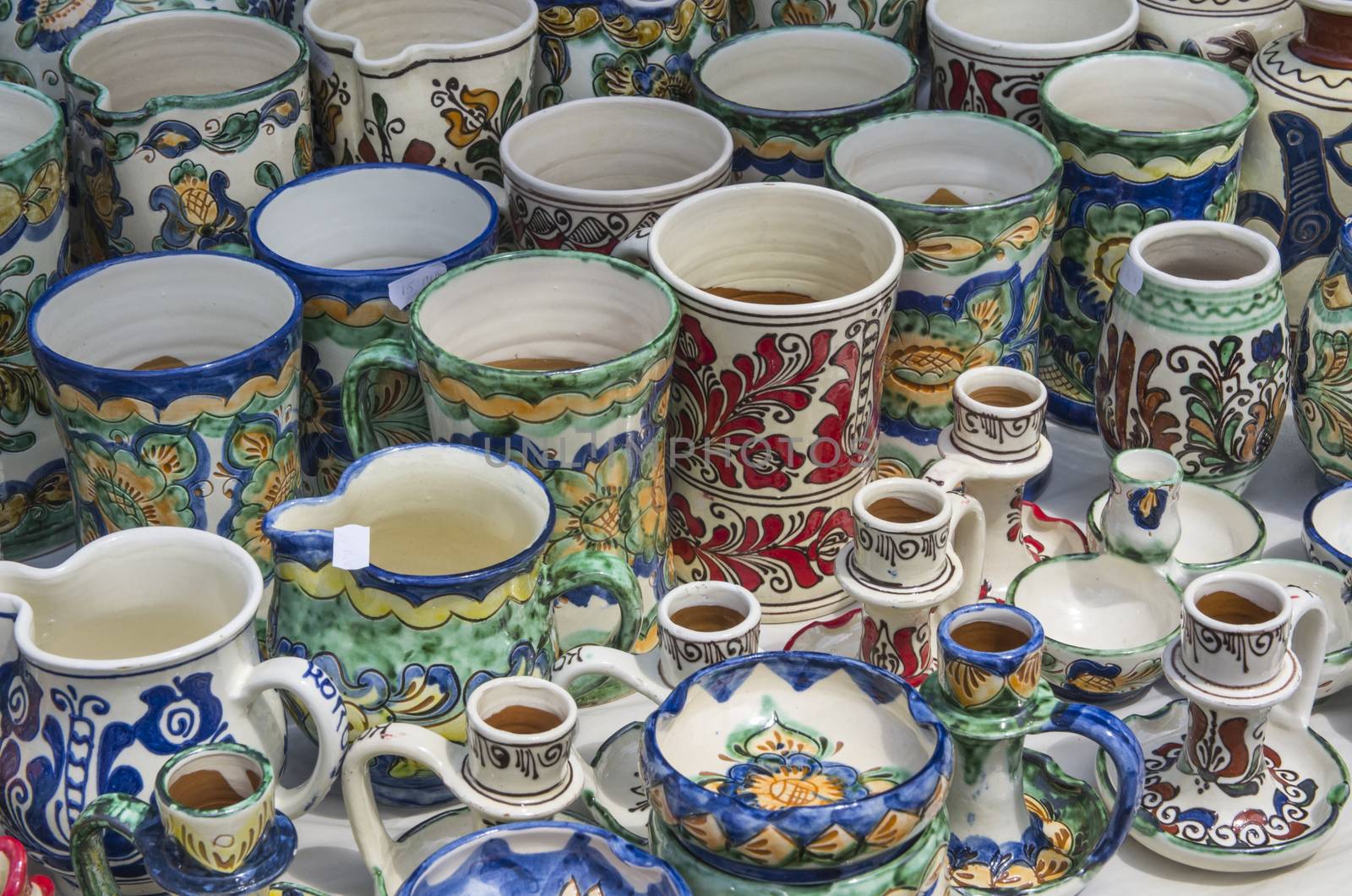 Romanian traditional pottery handcrafted mugs at a souvenir shop