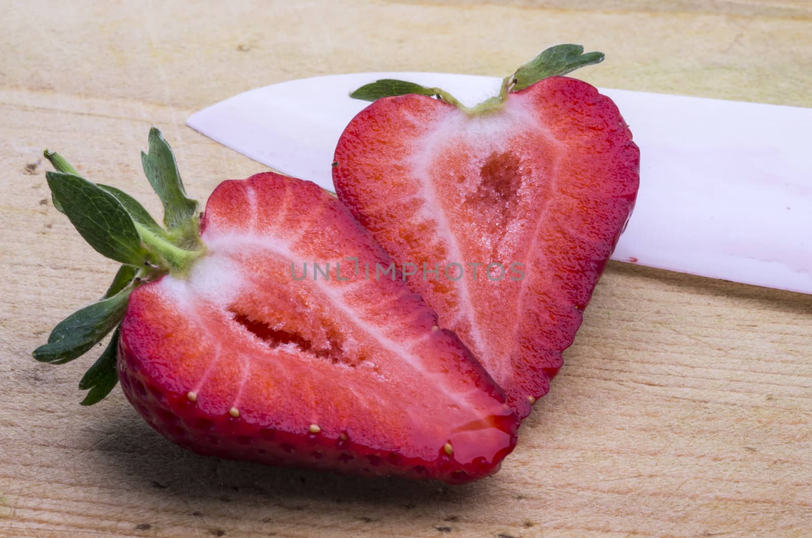 Strawberry cut in half, close up image