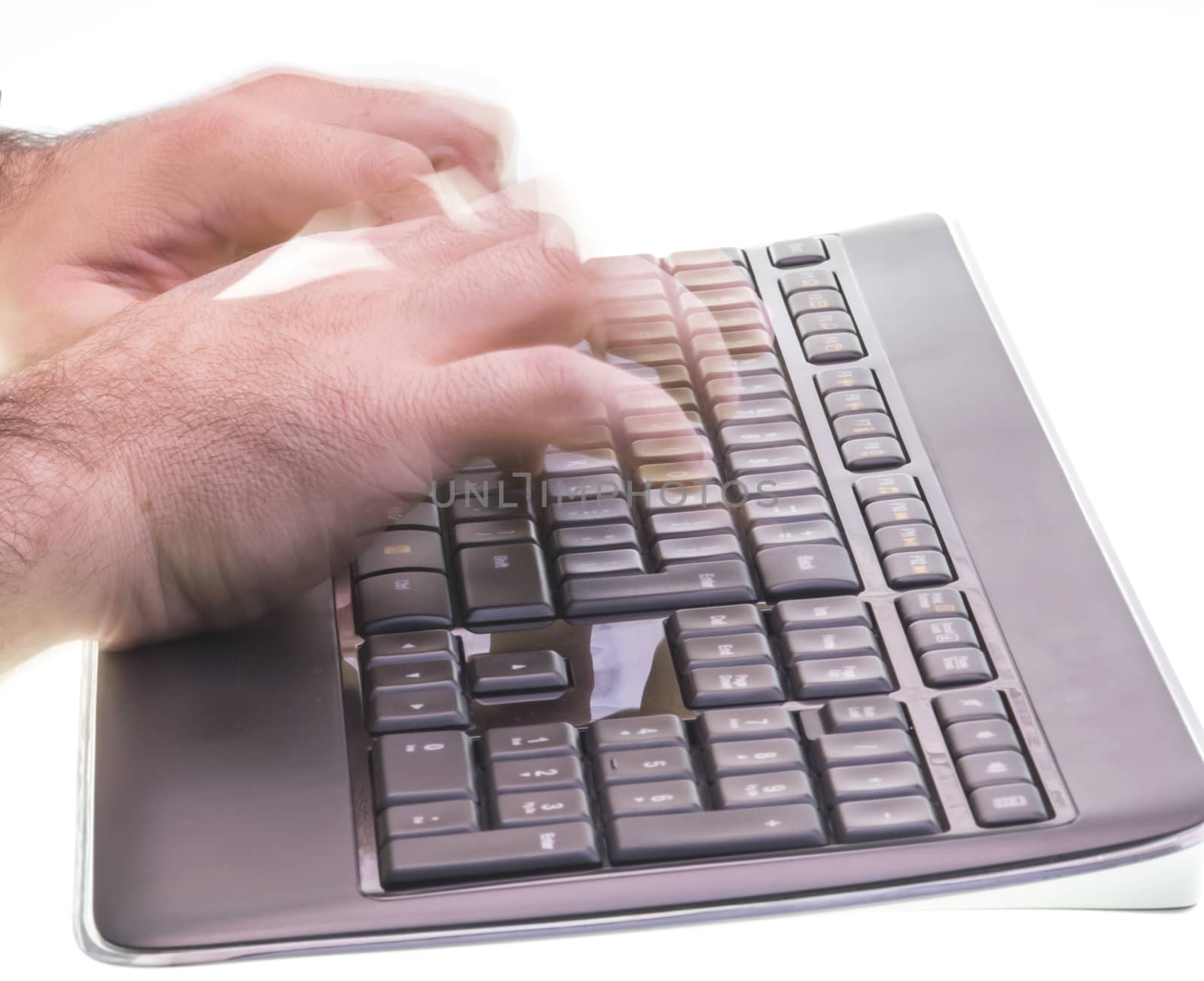 Fast typing: two hands typing on a black keyboard