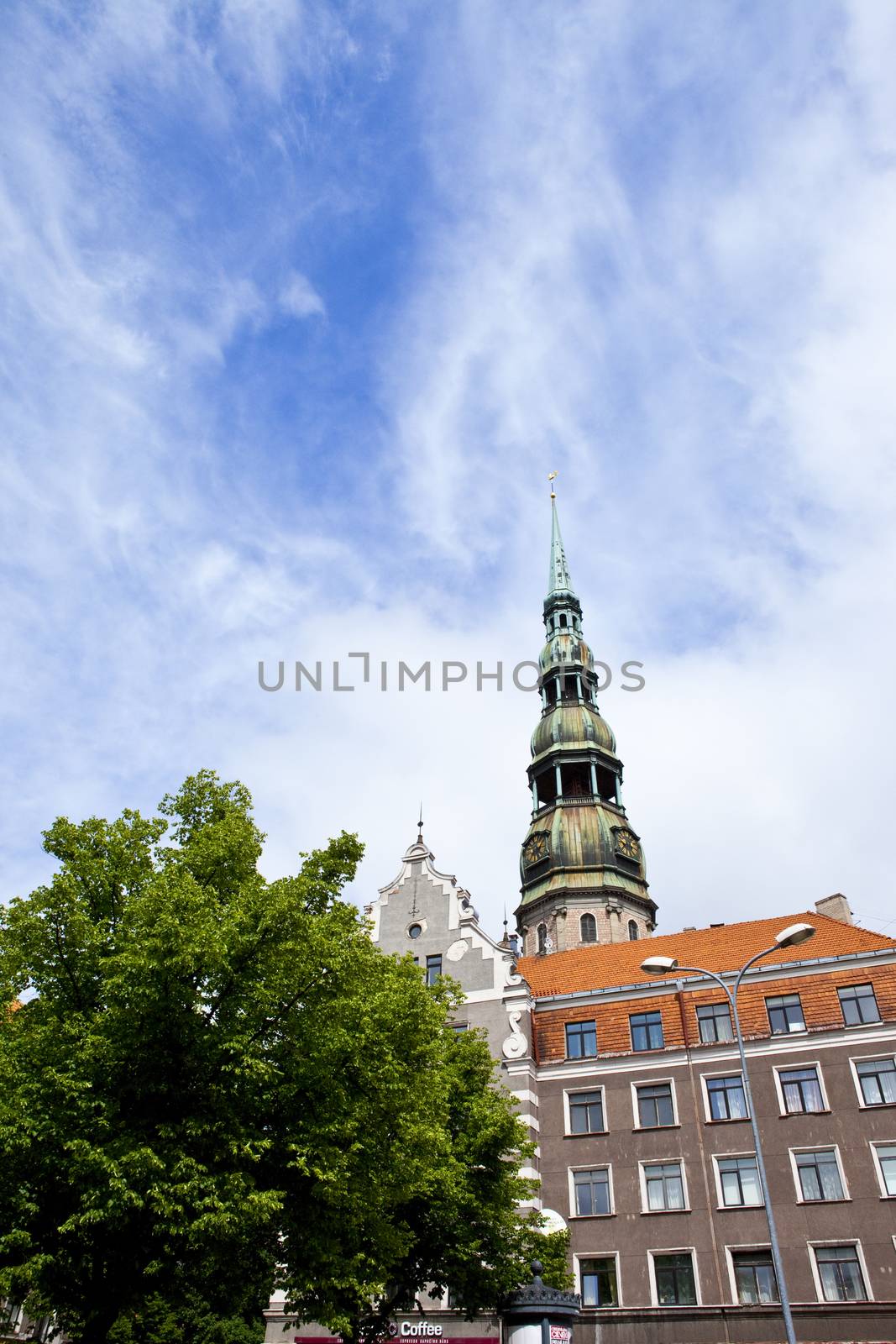 The steeple of the magnificent St. Peter's Church towering over the Old Town in Riga, Latvia.