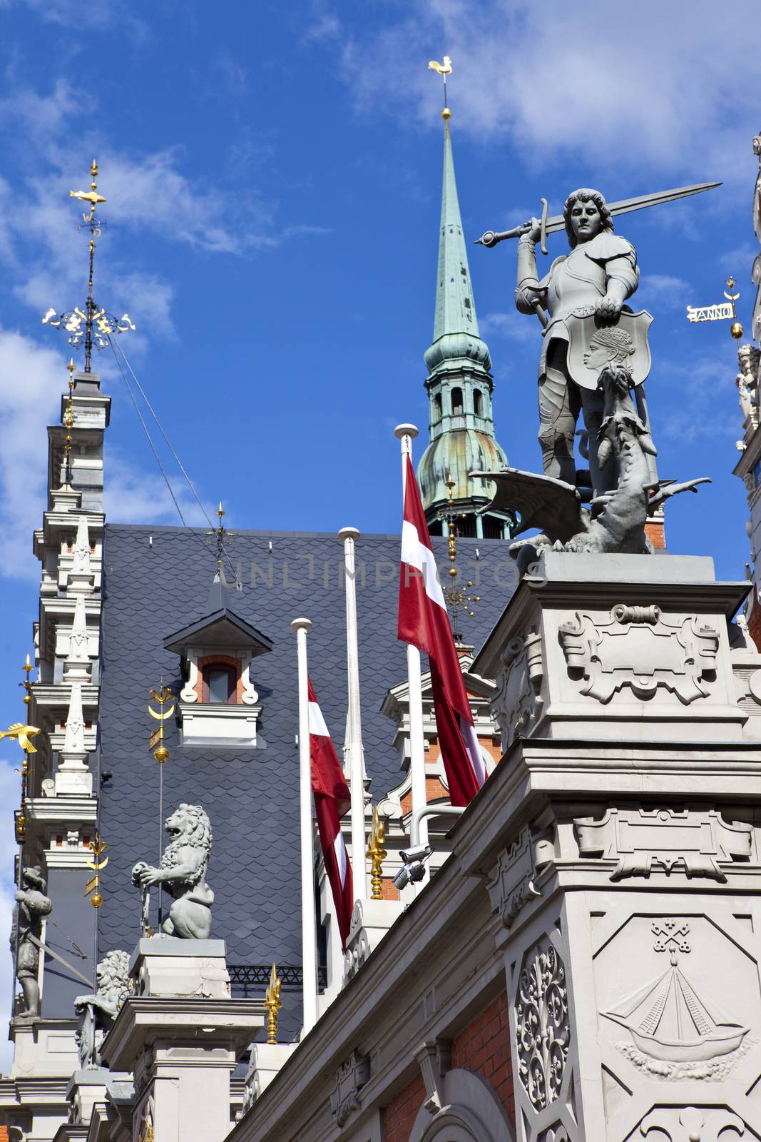 The historic House of the Blackheads with the steeple of St. Peter's Church in the background, in the old town of Riga in Latvia.