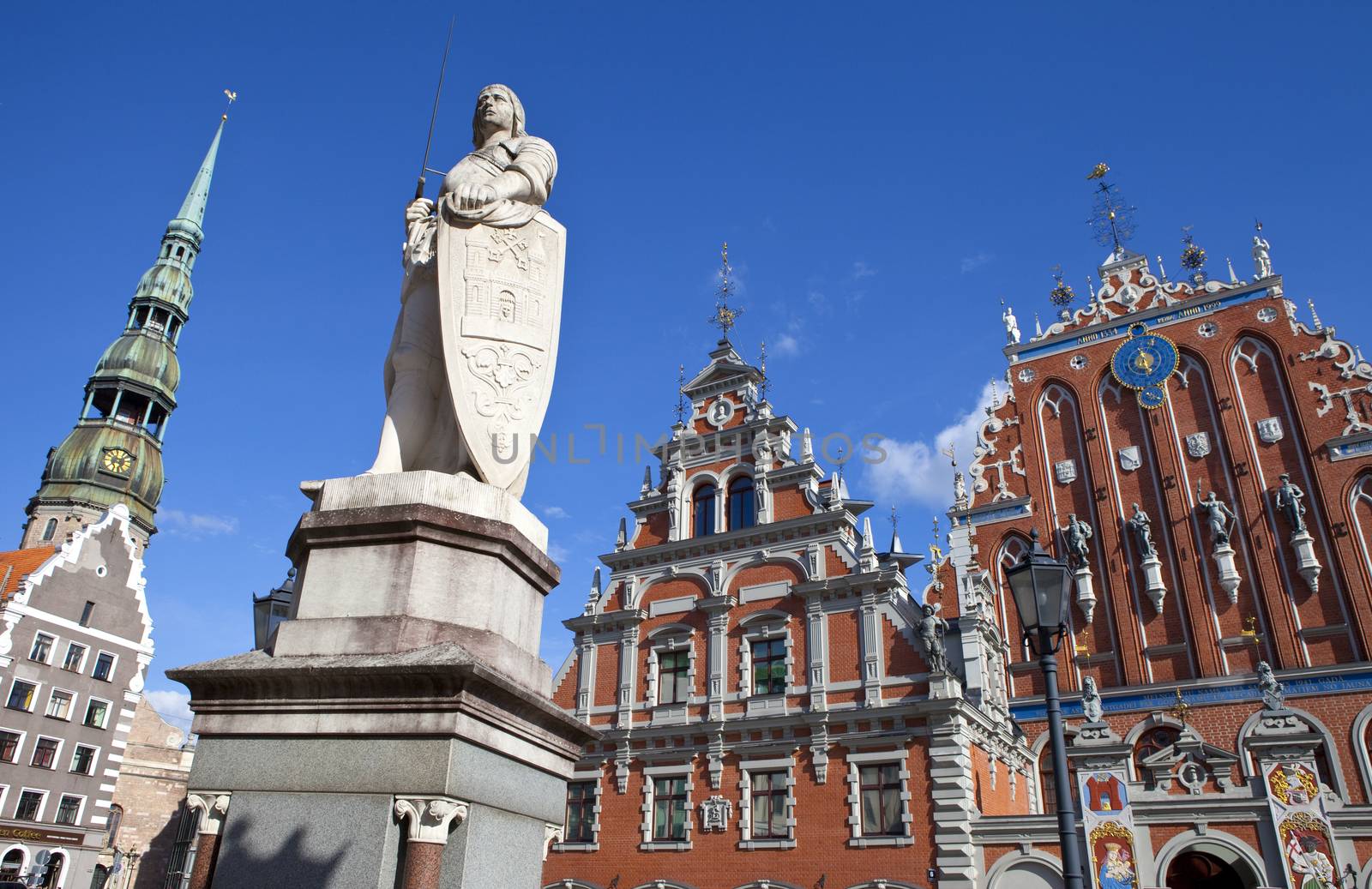 The historic House of the Blackheads, St. Peter's Church and statue of Saint Roland in the old town of Riga in Latvia.