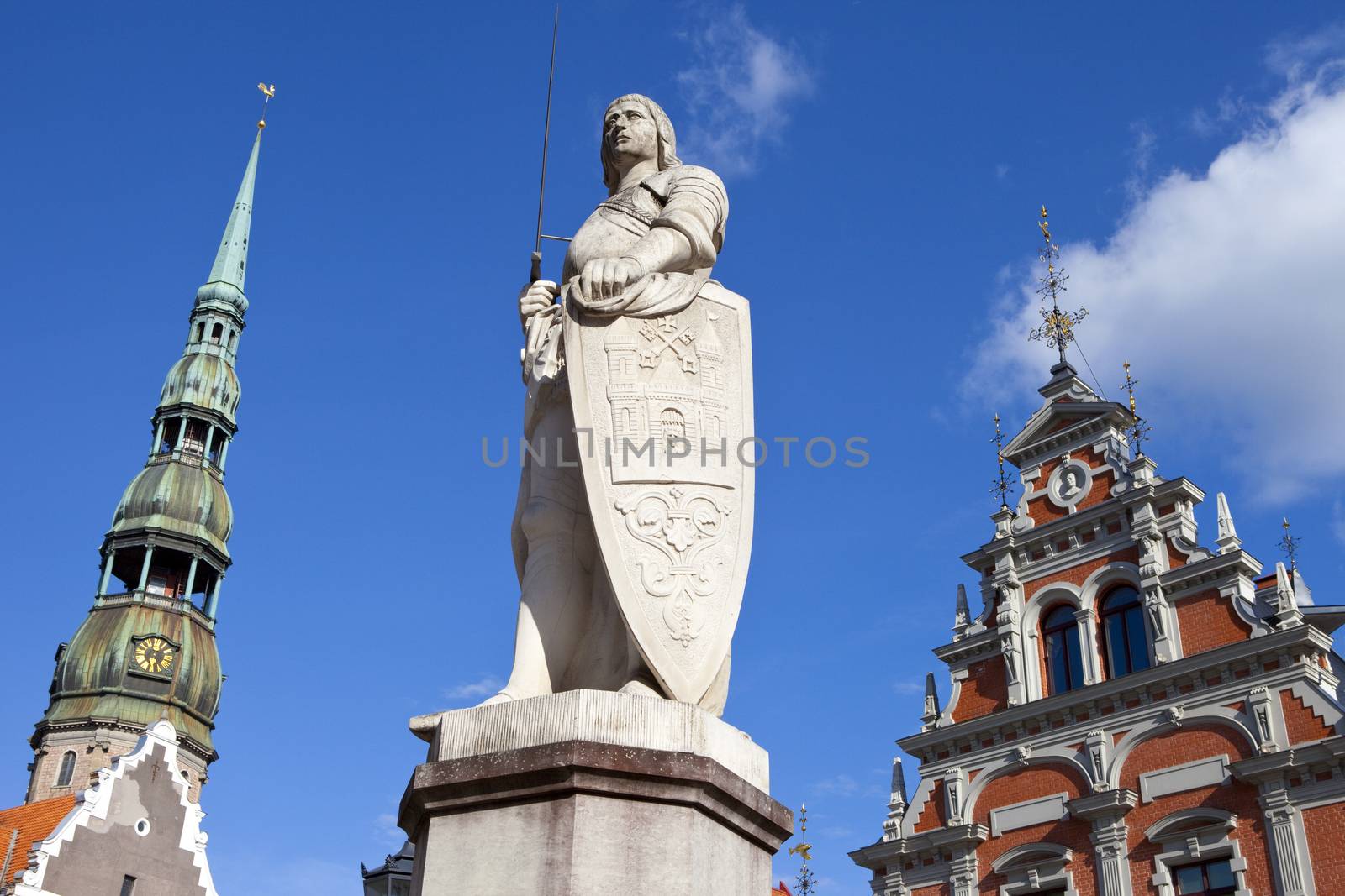 The historic statue of Saint Roland Statue, House of the Blackheadsand St. Peter's Church in the old town of Riga in Latvia.