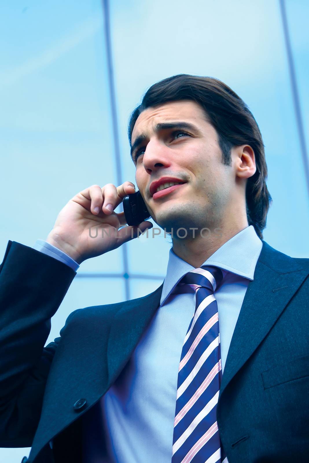 a businessman using mobile phone b by toocan