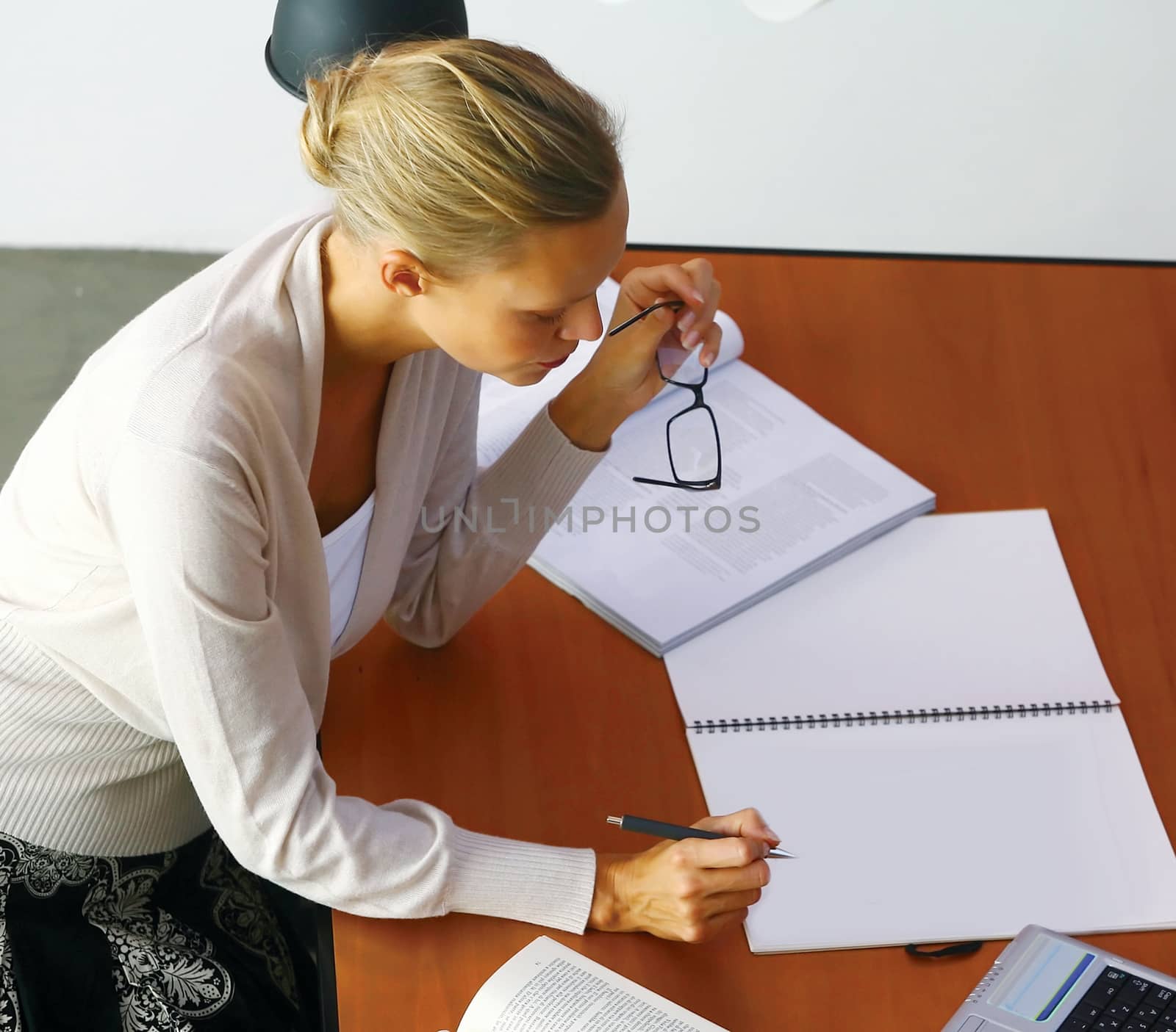 Portrait of blonde businesswoman in office