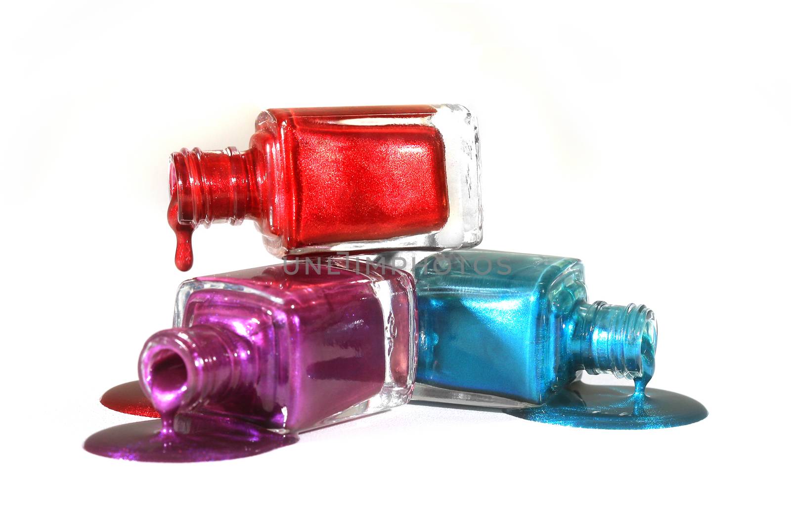 Salon Concept of Stacked Fingernail Polish of Red Blue and Purple