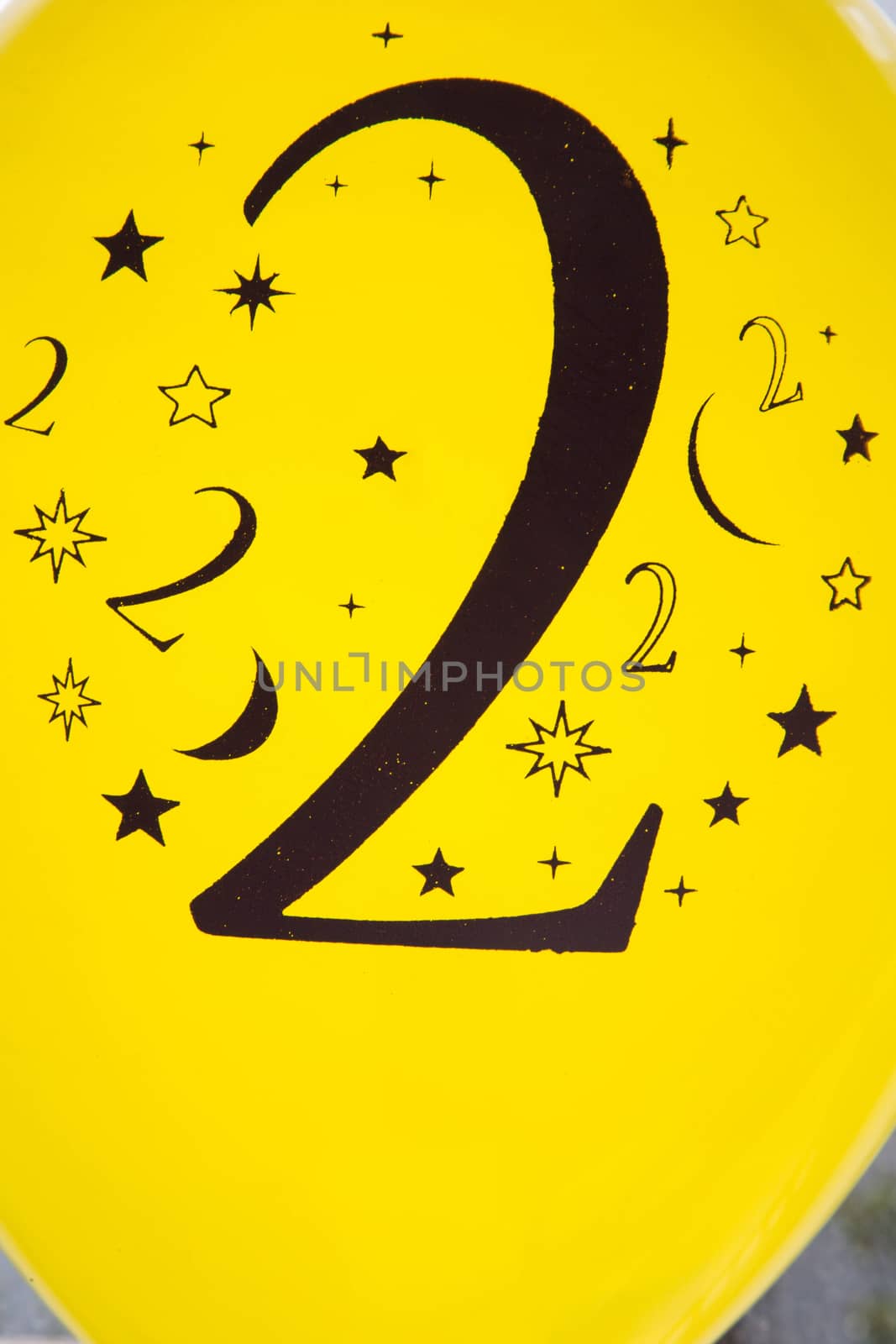 Number two printed in black on the yellow balloon