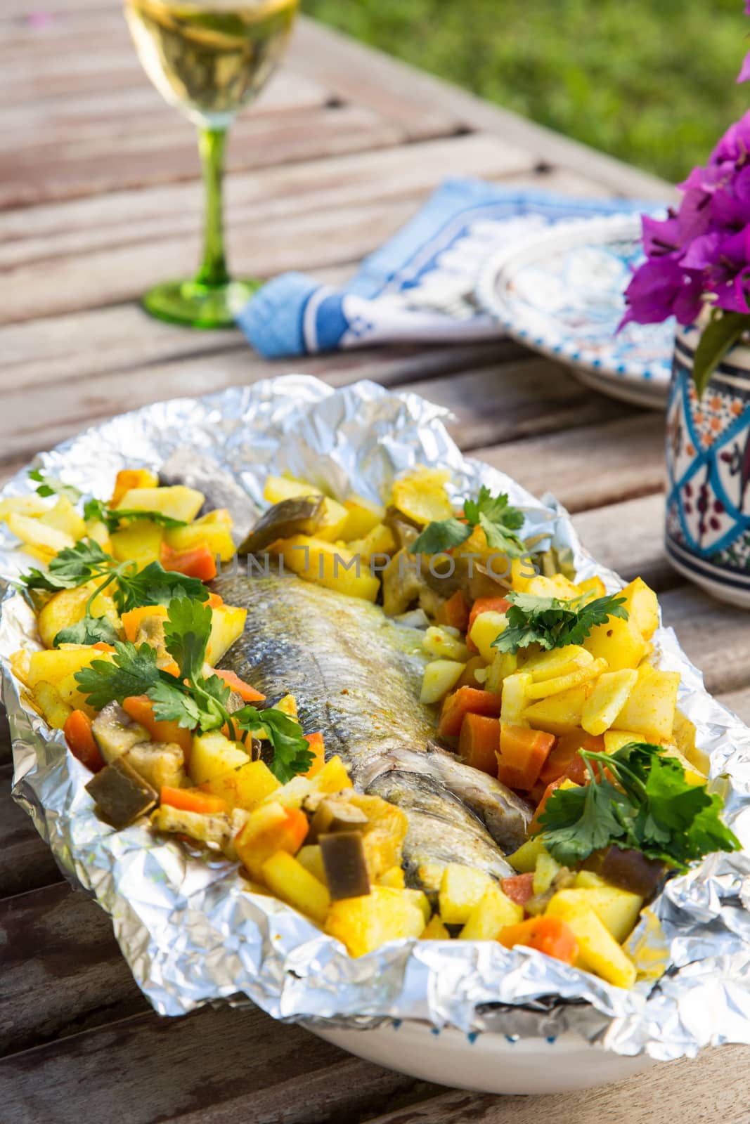 Baked sea bass with vegetables by tolikoff_photography