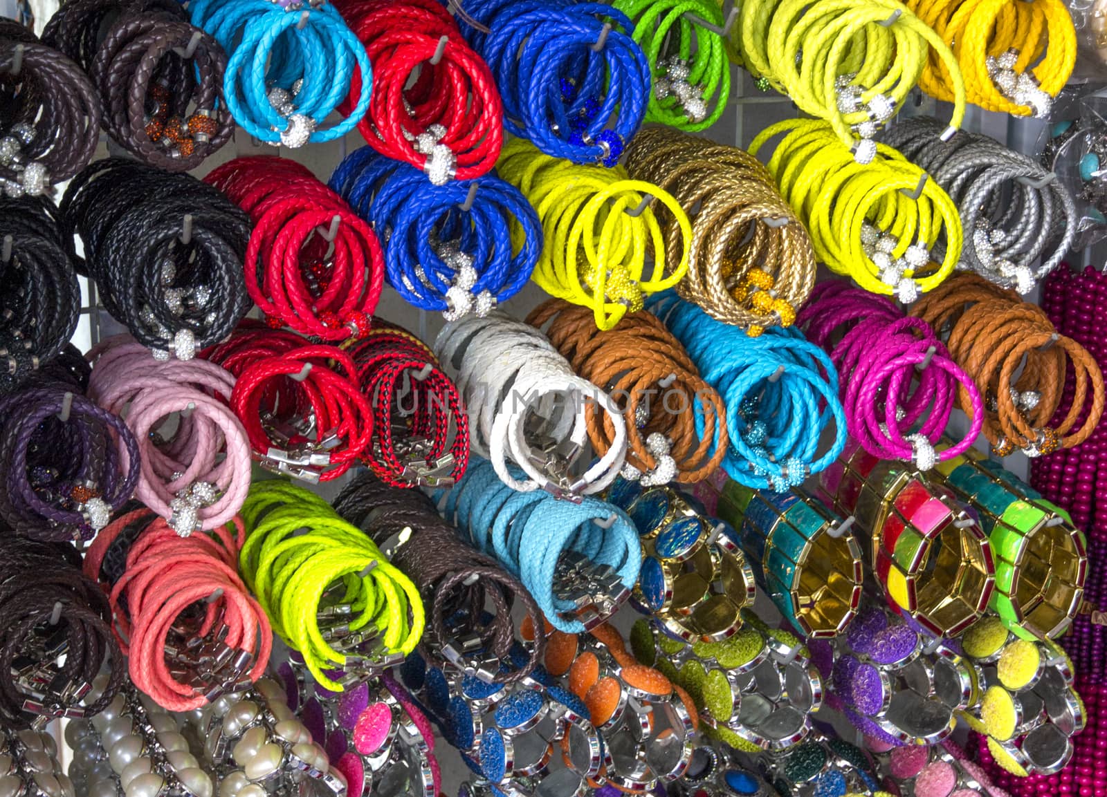 Bracelets and necklaces hanging in a Bangkok shop