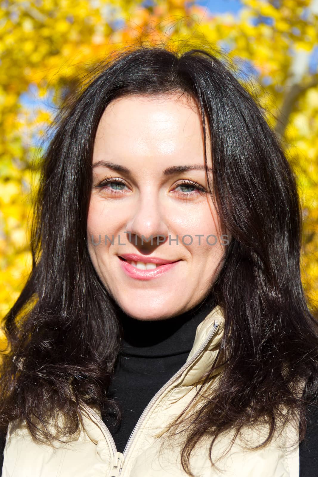 Photo of beautiful young brunette in autumn