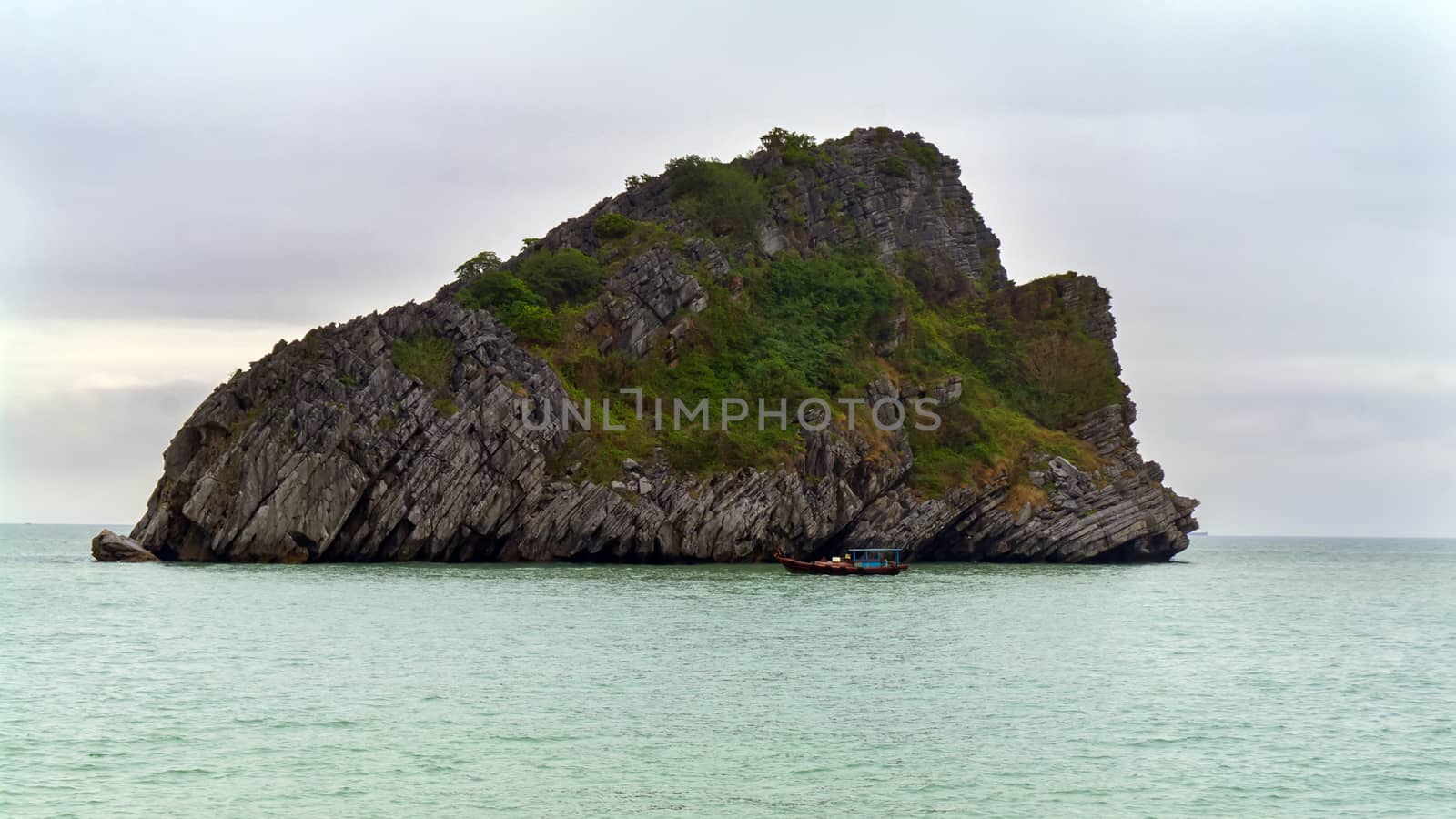 Schooner and Island in Ha Long Bay, Vietnam. 