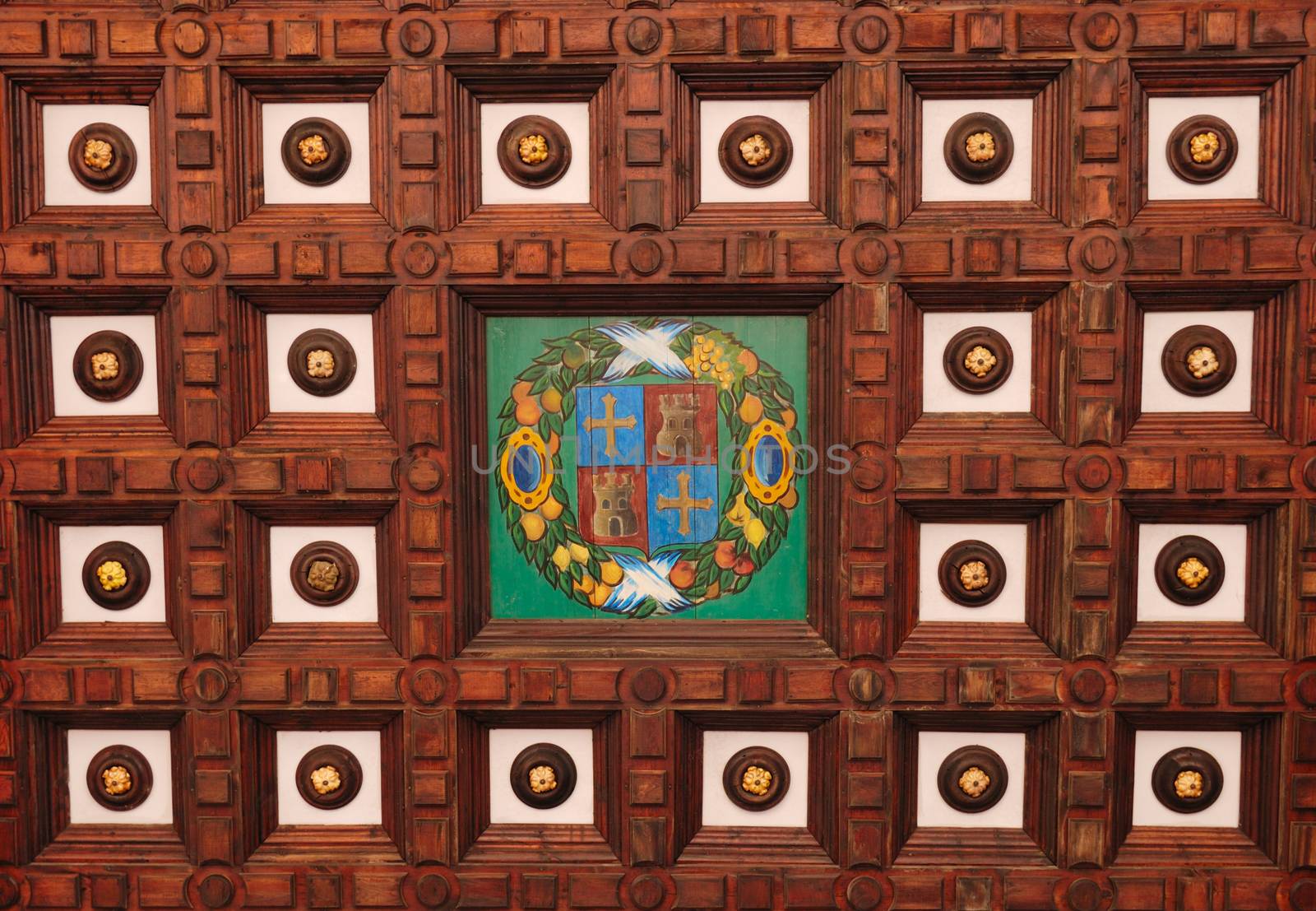 Wooden ceiling with shield of a spanish city at Spain square, that is a square located in Maria Luisa Park, in Seville, Spain built in 1928 for the Ibero-American Exposition of 1929. 