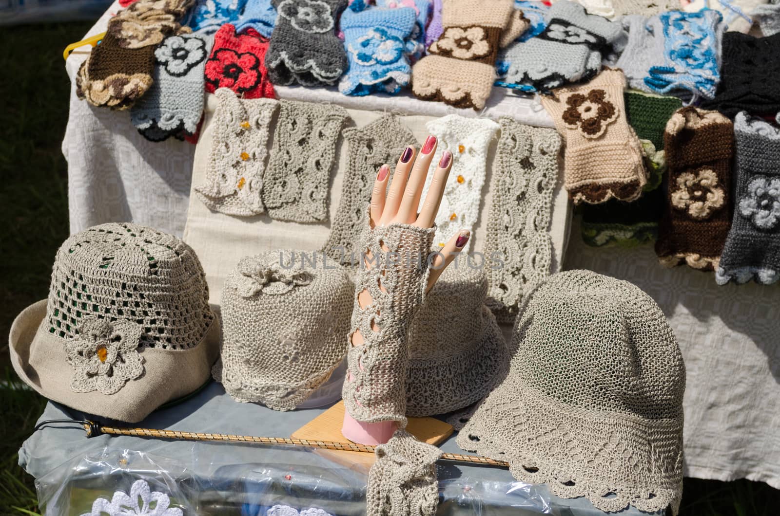 female linen hats and wristlets at market trade by sauletas