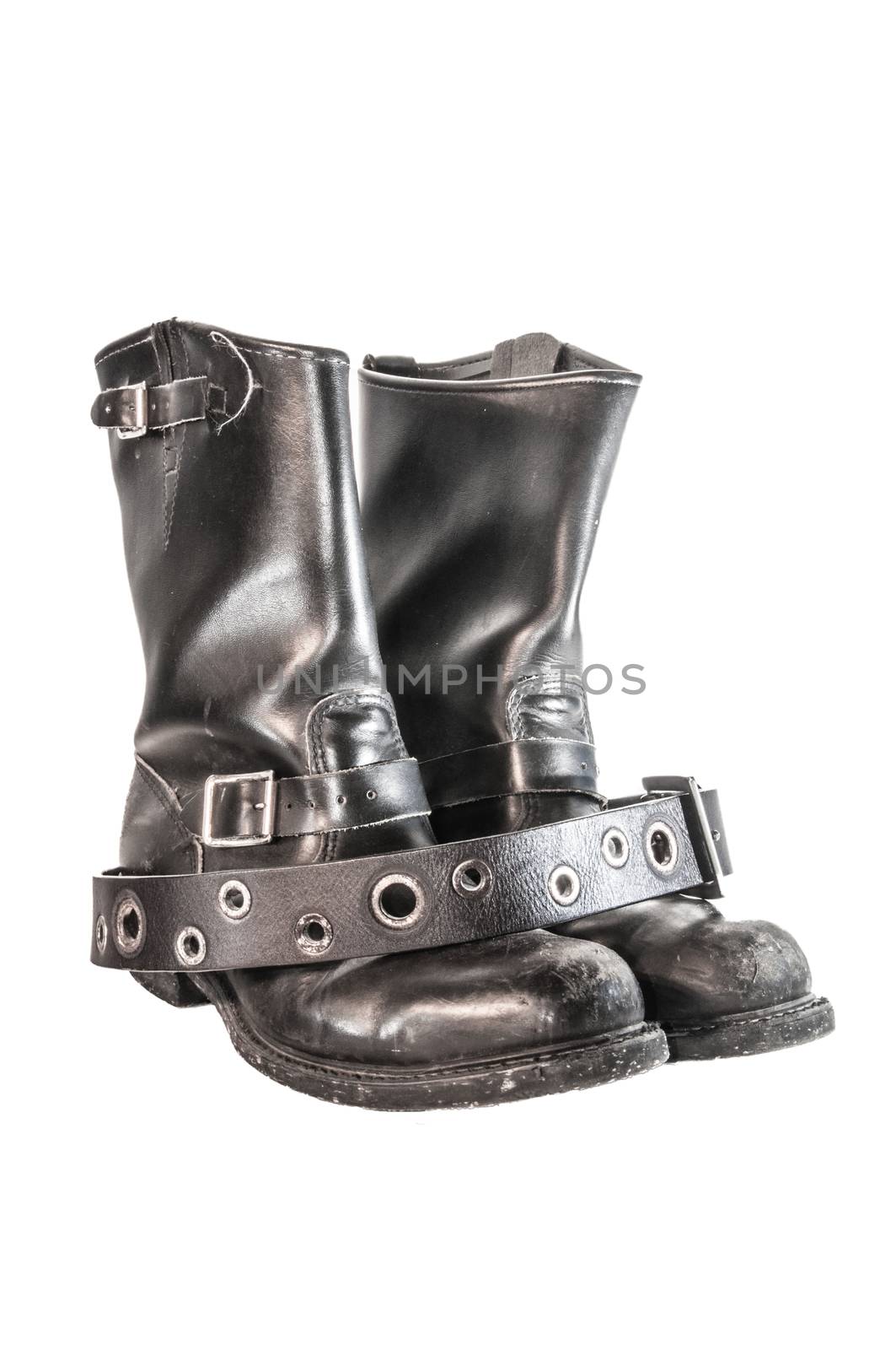 Black leather biker boots and belt isolated over white