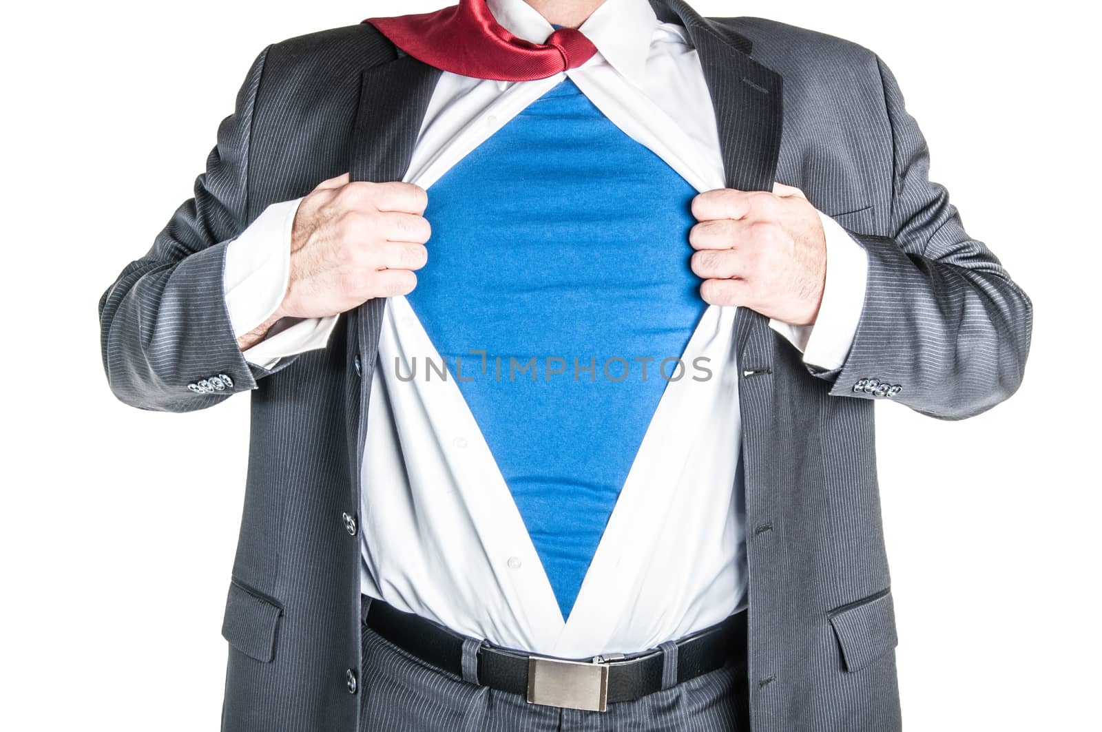 Business man tearing shirt to become a superhero