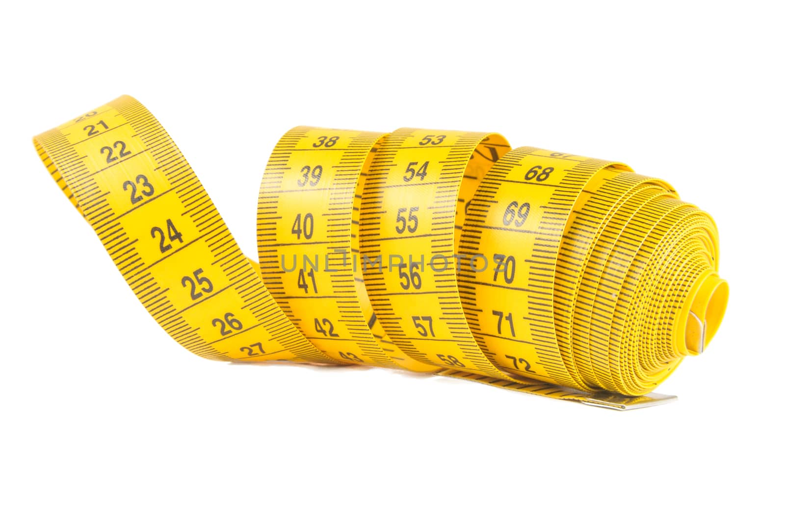 Roll of yellow measuring tape rolled up over white background