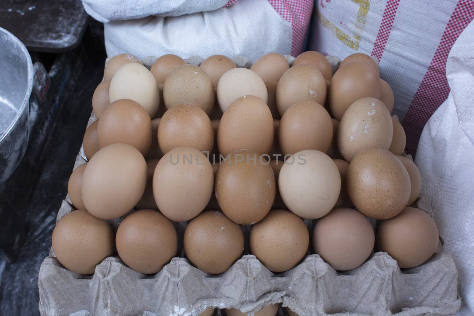 exposed eggs in carton container