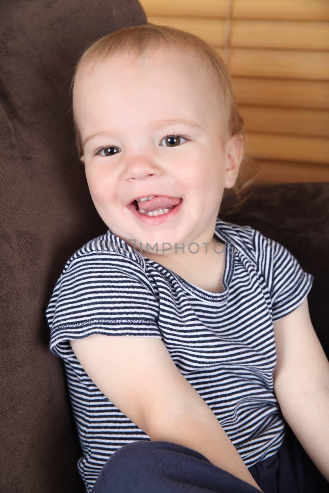 Cute toddler boy with happy facial expression