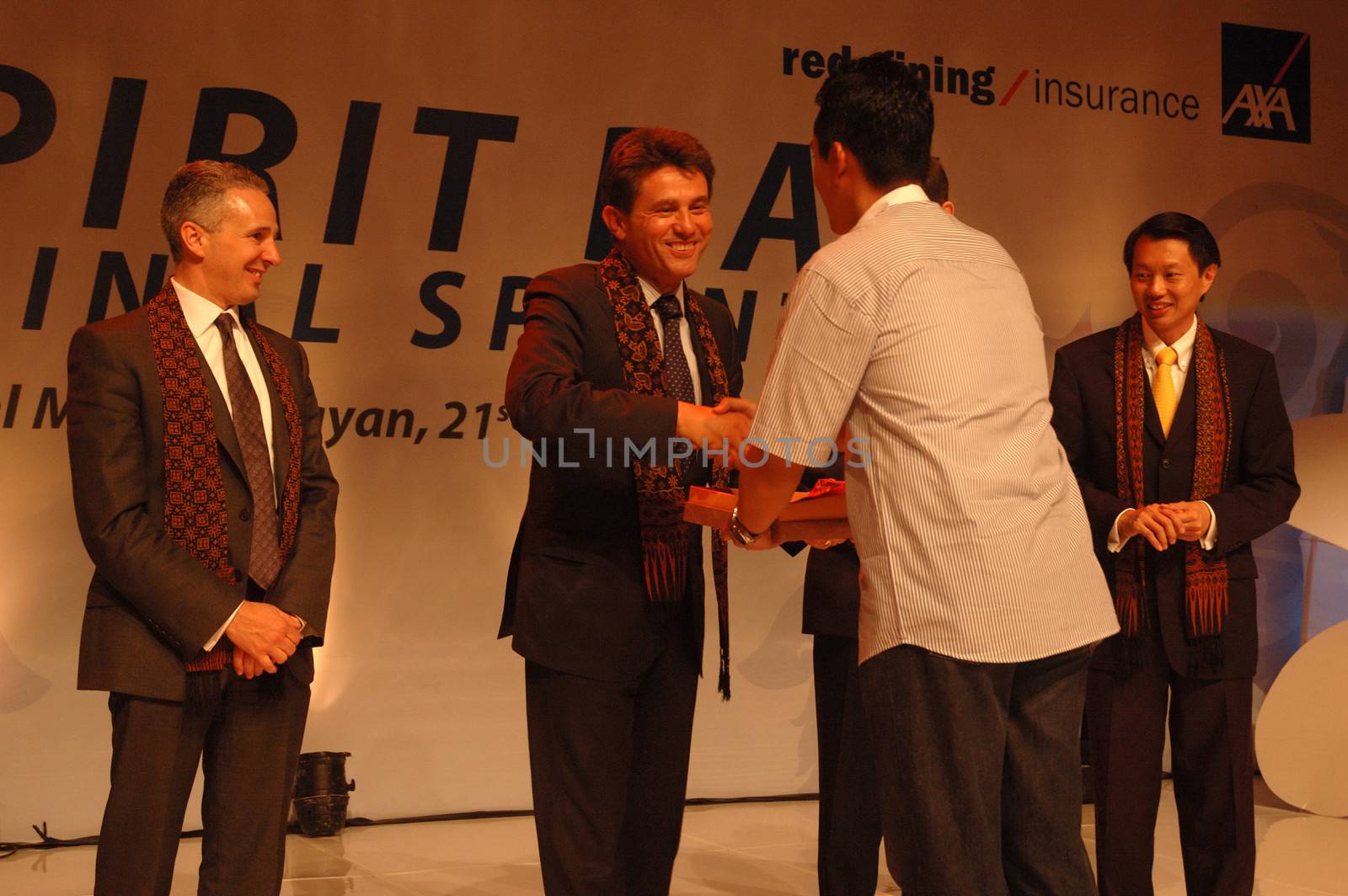 jakarta, indonesia-september 21, 2010: AXA CEO-Henri de Castries receiving gift from AXA indonesia in AXA spirit day at mulia hotel senayan, jakarta-indonesia.