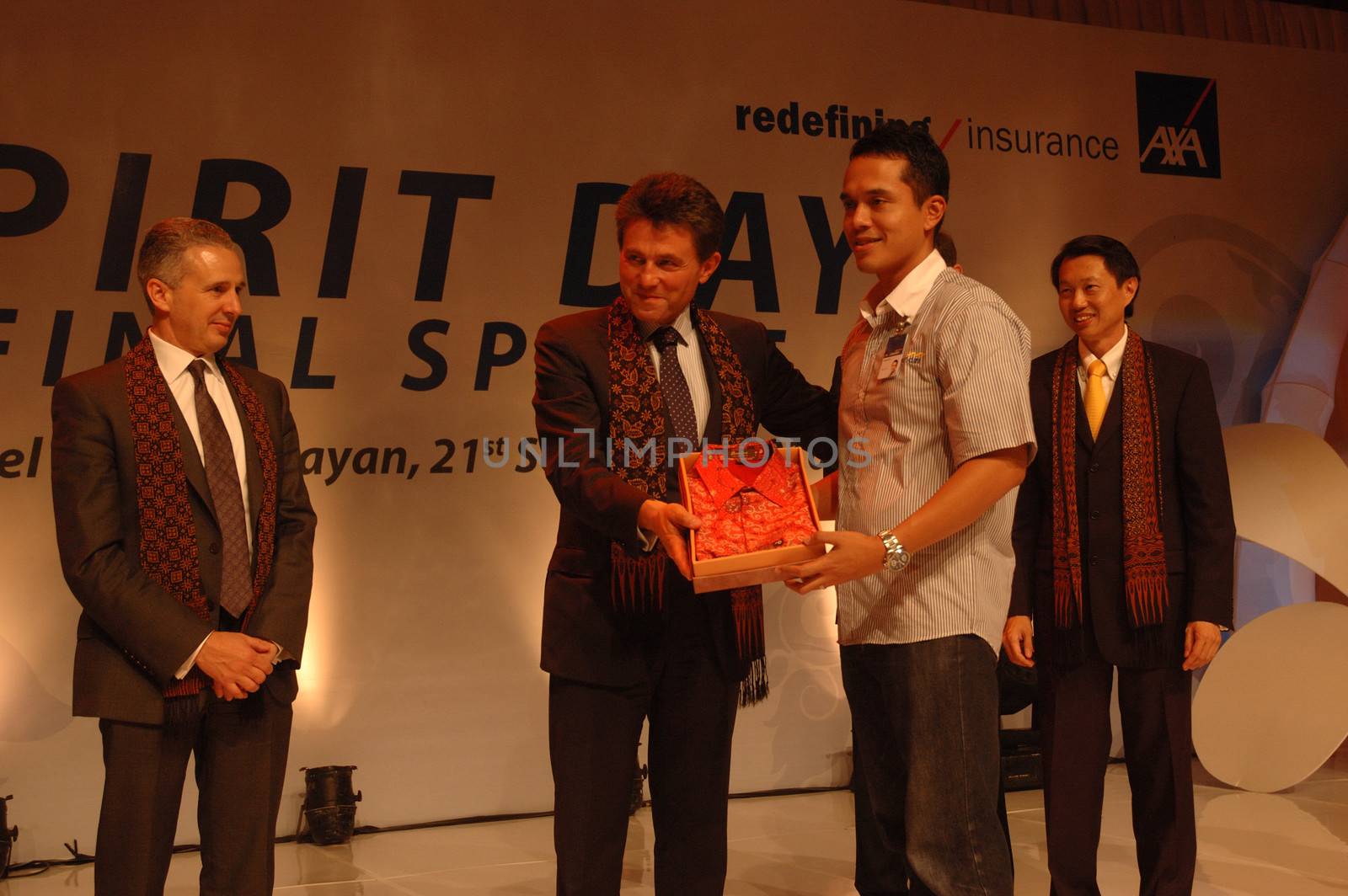 jakarta, indonesia-september 21, 2010: AXA CEO-Henri de Castries receiving gift from AXA indonesia in AXA spirit day at mulia hotel senayan, jakarta-indonesia.