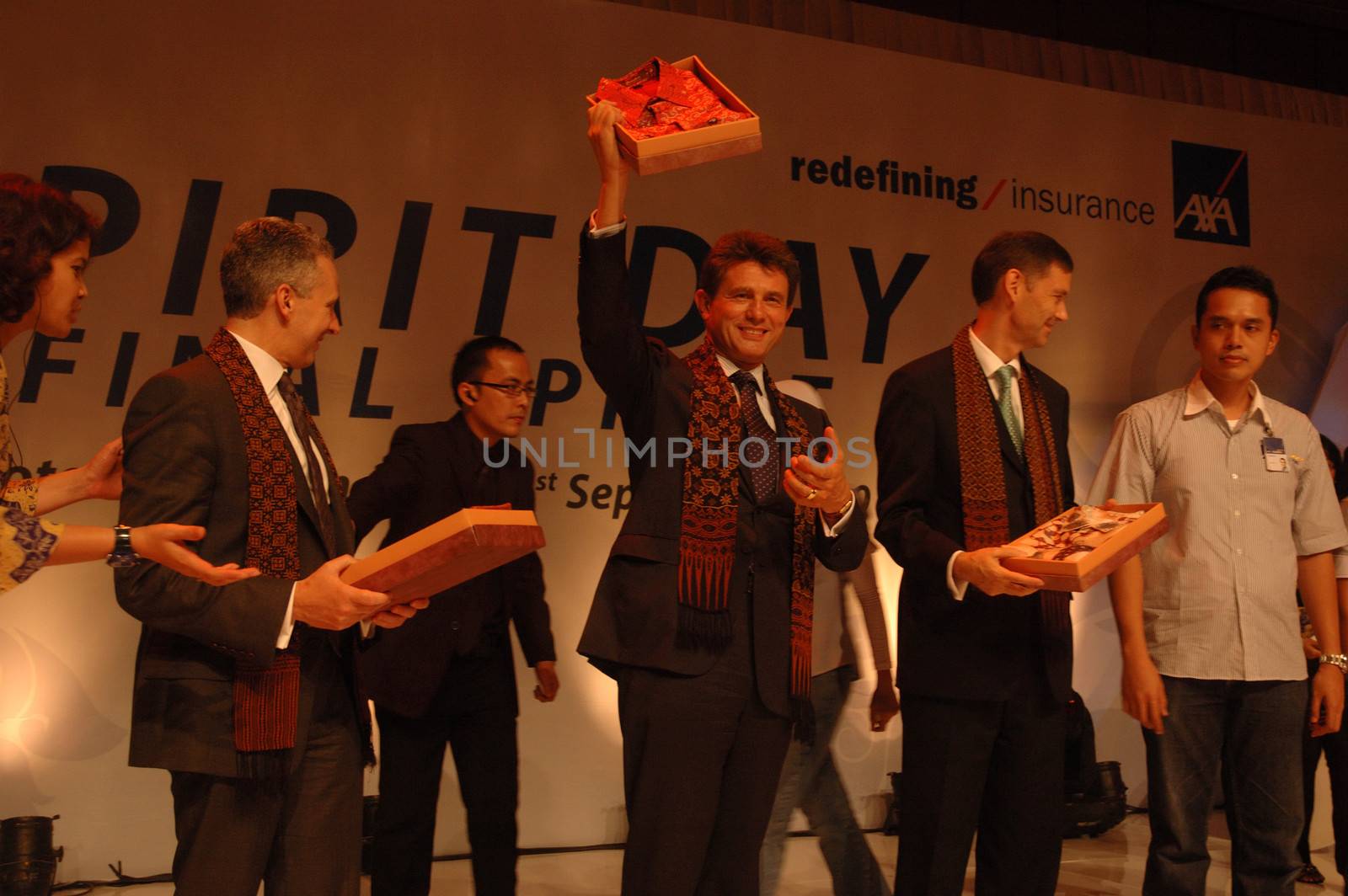 jakarta, indonesia-september 21, 2010: AXA CEO-Henri de Castries receiving gift from AXA indonesia in AXA spirit day at mulia hotel senayan, jakarta-indonesia.